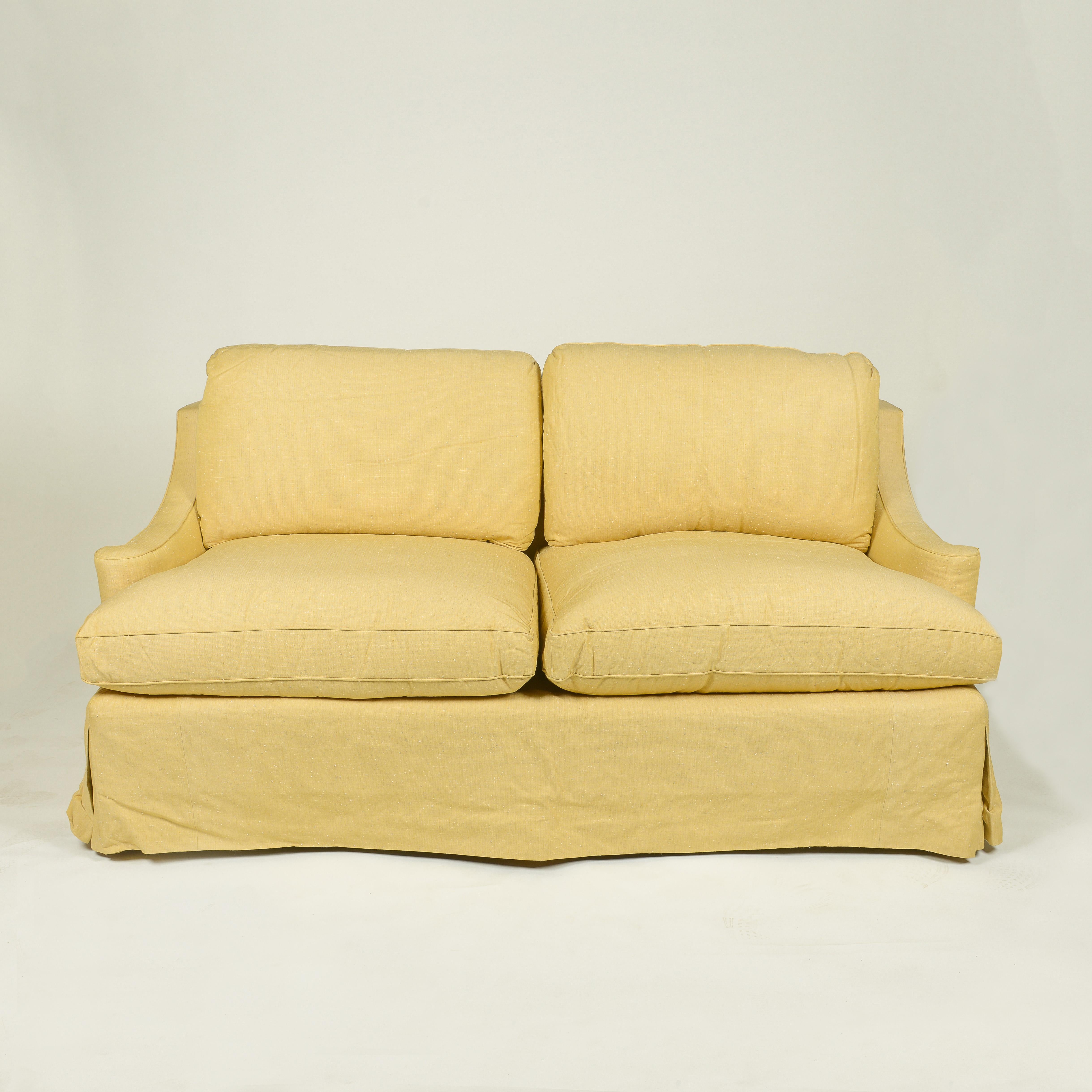 Upholstered in a wheat yellow slubby silk in a modified Regency form; the highest quality construction with down and foam; custom made for Albert Hadley.