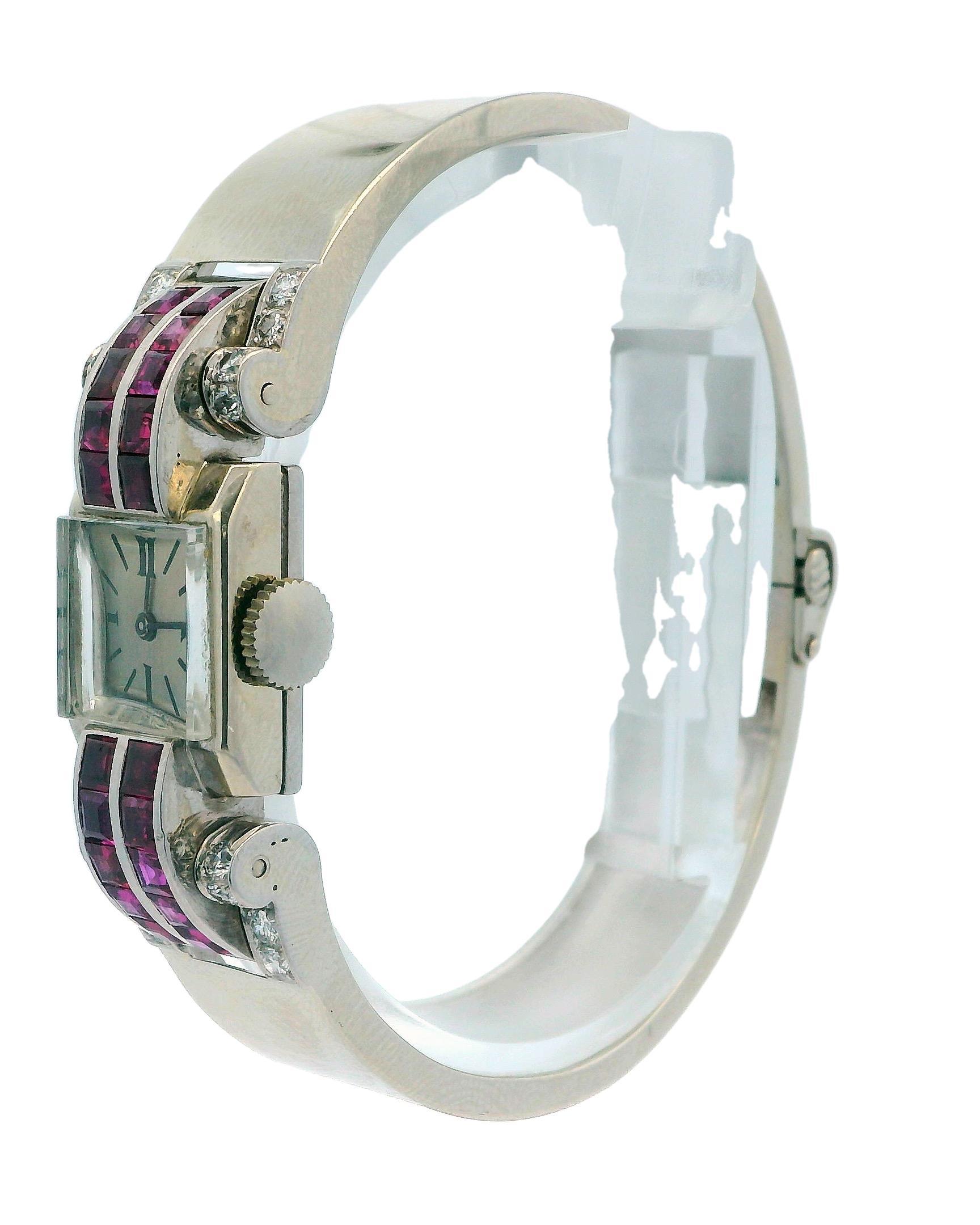 This exquisite watch is a perfect blend of luxury and sophistication, crafted from 14k white gold. It showcases 3.5 carats of striking red baguette-cut rubies, which add a bold splash of color to the piece. In addition to the rubies, the watch is