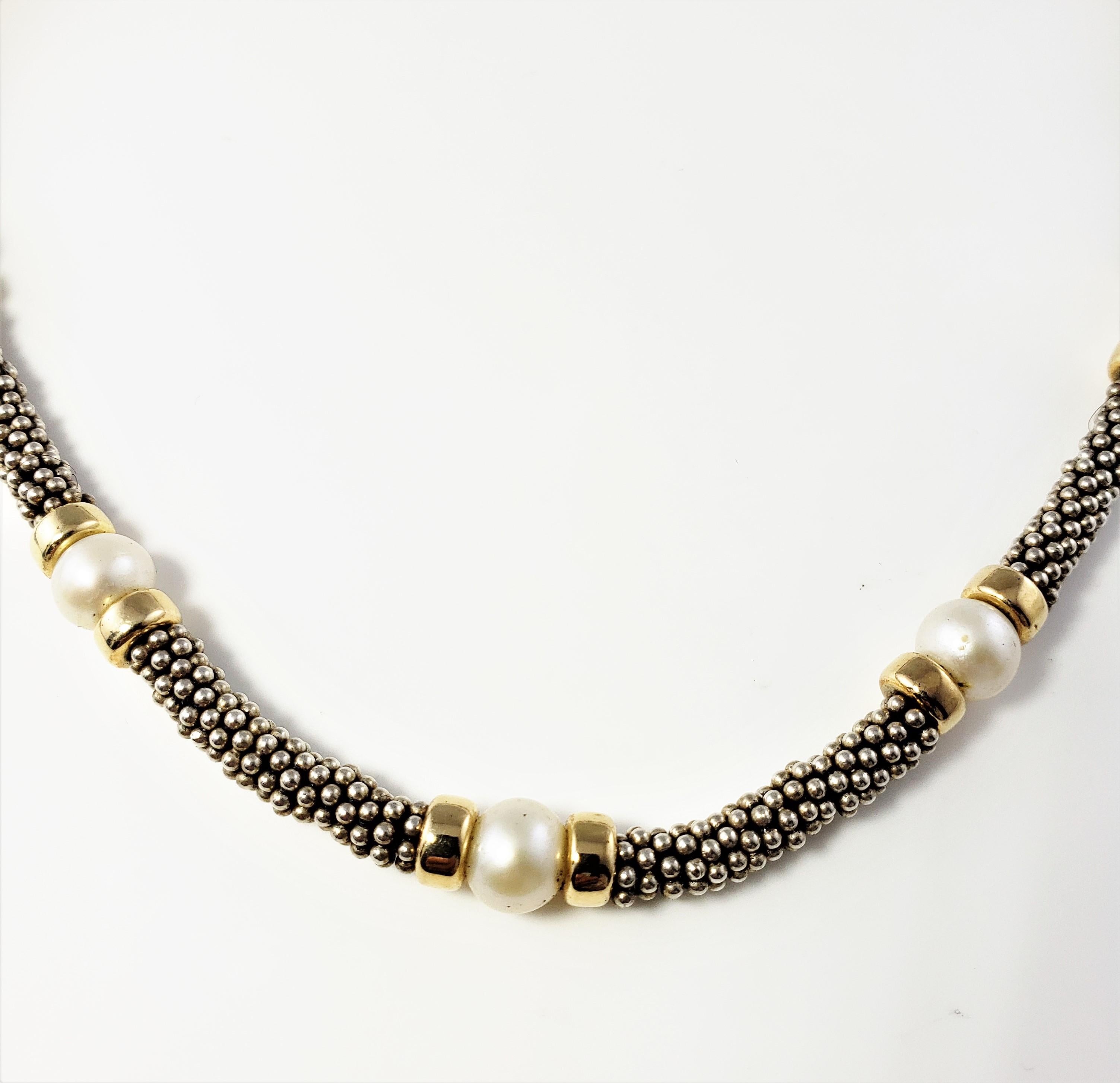 Vintage Deborah Armstrong Co. Sterling Silver, 18K Yellow Gold and Pearl Necklace-

This elegant toggle necklace nine cultured pearls (7 mm each) set in beautifully detailed sterling silver and 18K yellow gold. Necklace width: 5 mm.

Size: 16.5