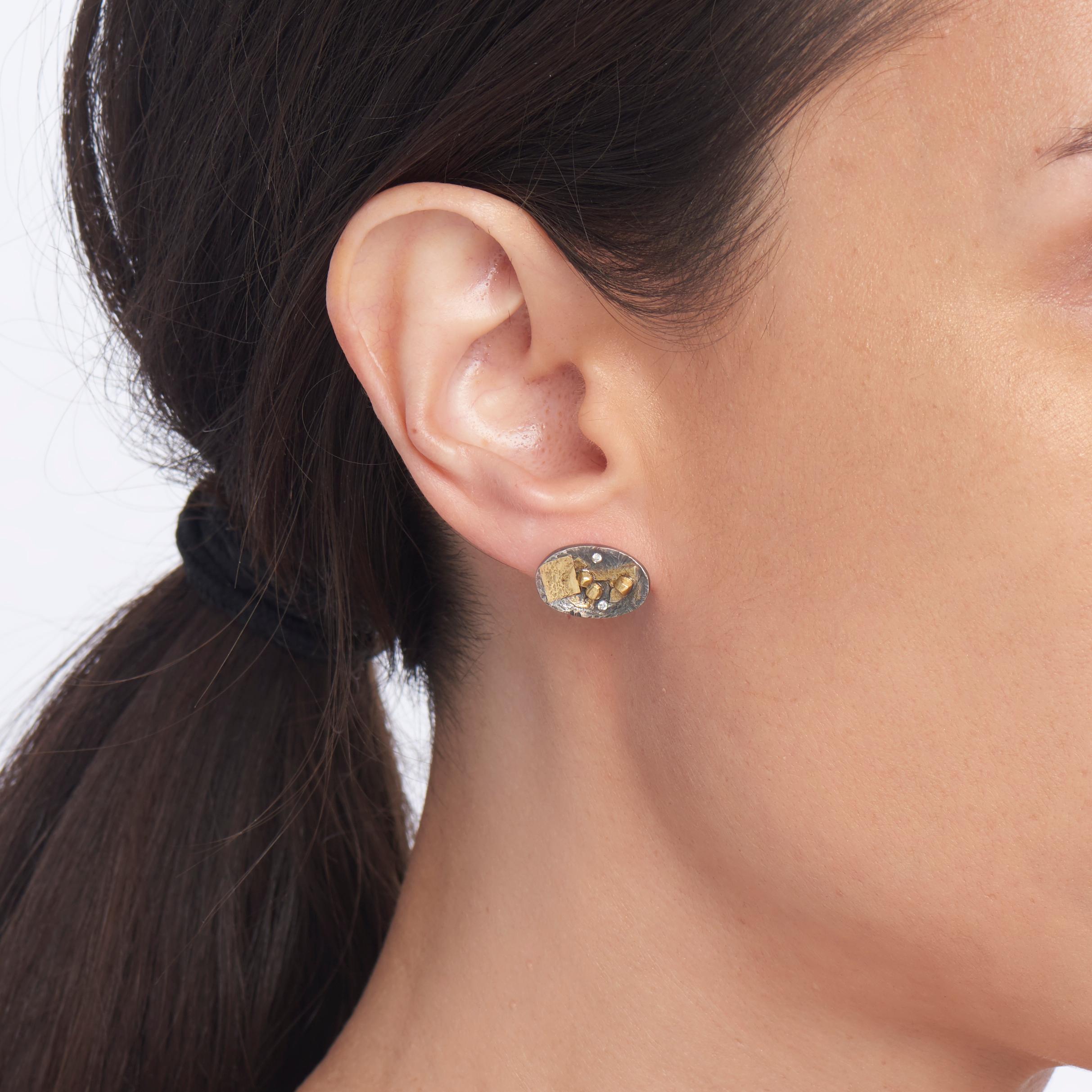 Fragments of 22 karat yellow gold and tiny white diamonds (.08 total carat weight) give these contemporary mixed metal earrings a poetic feel.  The size of the oval is perfect for daytime wear.  The oxidized sterling silver contrasts beautifully