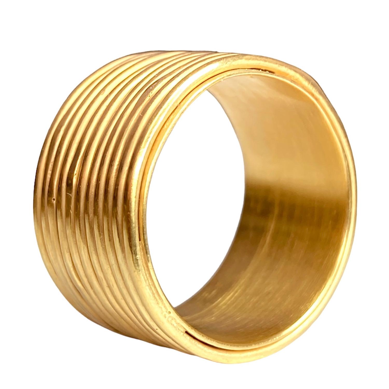 18kt Yellow Gold Vermeil Ring by Deborah Murdoch is from the Circlet Collection featuring a wide band with eleven stacked rings. The ring has a silky satin polished finish.

The inspiration for the circlet collection comes from the ancient treasured