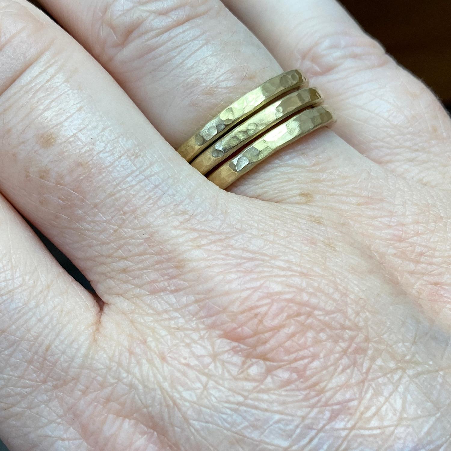 18kt Yellow Gold Textured Rings by Deborah Murdoch. Each ring band is slightly planished giving that textural feel and has a silky satin finish. Each ring is hammered by hand to give an organic texture making each ring one of a kind. This is for