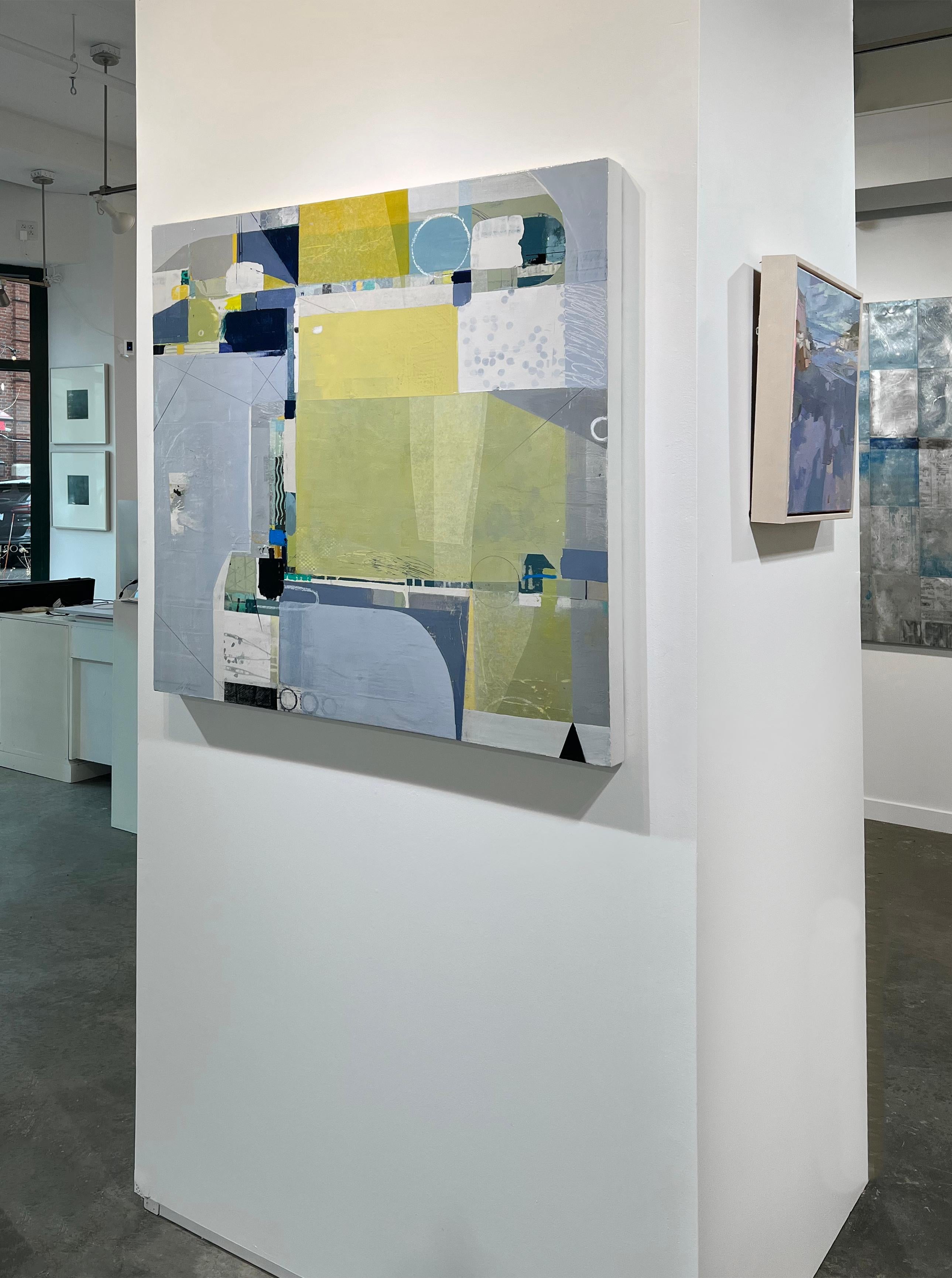 This abstract collage painting by Deborah T. Colter features a cool, light blue and green palette. Found paper are layered with paint in near geometric shapes, with thin line work and circular shapes running throughout the composition. The painting