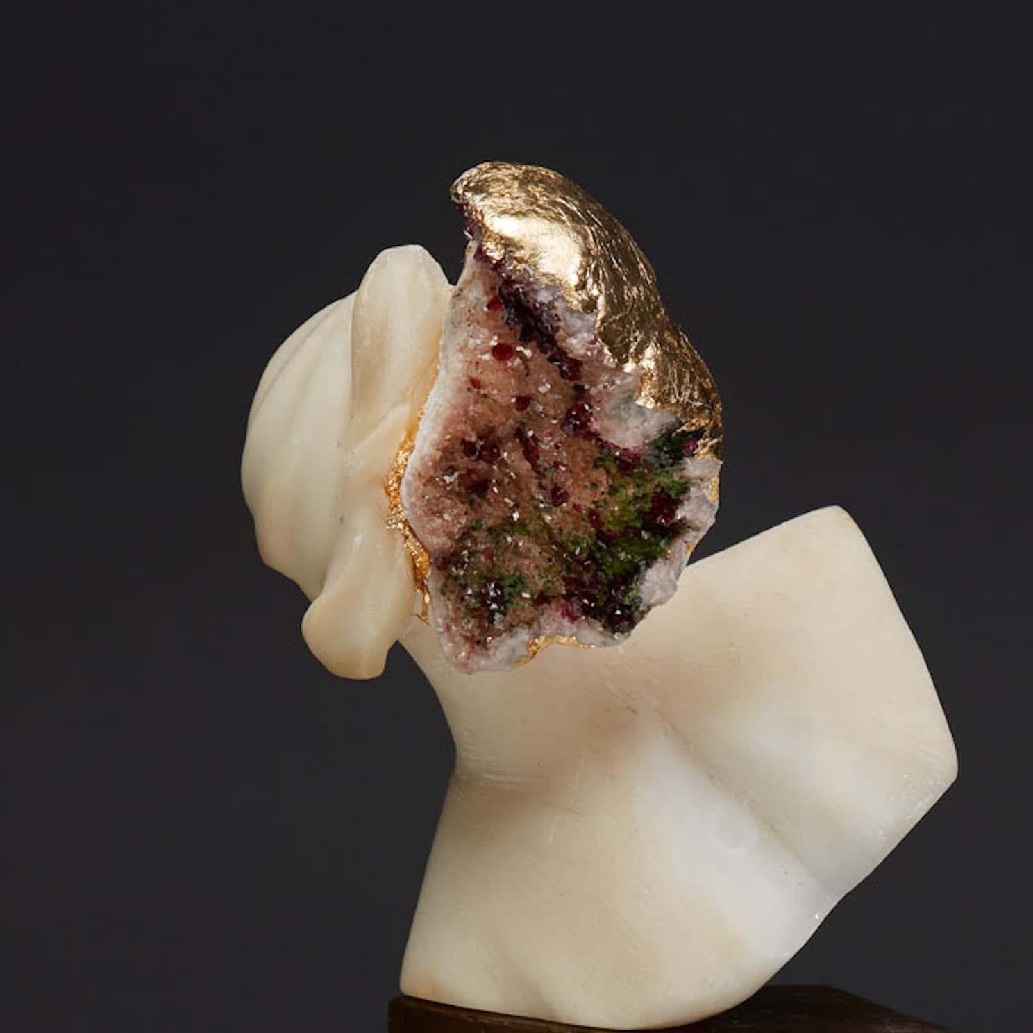 Debra Baxter is a sculptor and jewelry designer who combines carved alabaster with crystals, minerals, metals, and found objects. She received her MFA in Sculpture from Bard College in 2008 and her BFA from the Minneapolis College of Art and Design