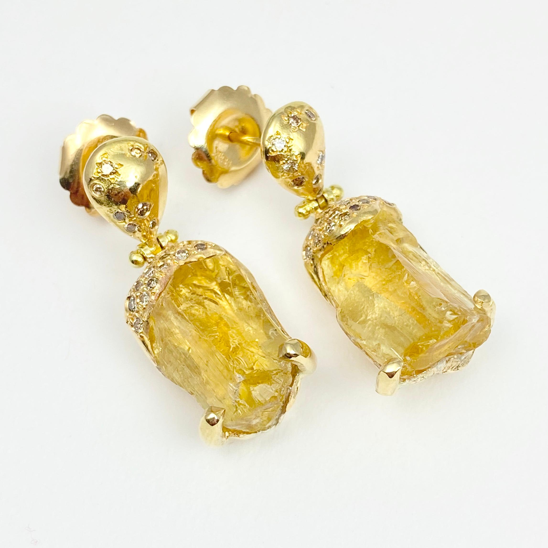 The hand-made and one-of-a-kind Jackson earrings, from our Watu Collection, are crafted with 18-karat recycled yellow gold, and feature two untreated, Tenda Cut, natural color yellow scapolite (a type of feldspar), and 50 round champagne accent