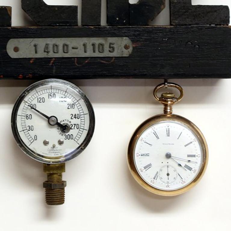 Unique assemblage of painted wood and metal with pocket watch, pressure gauge, and compass attached.