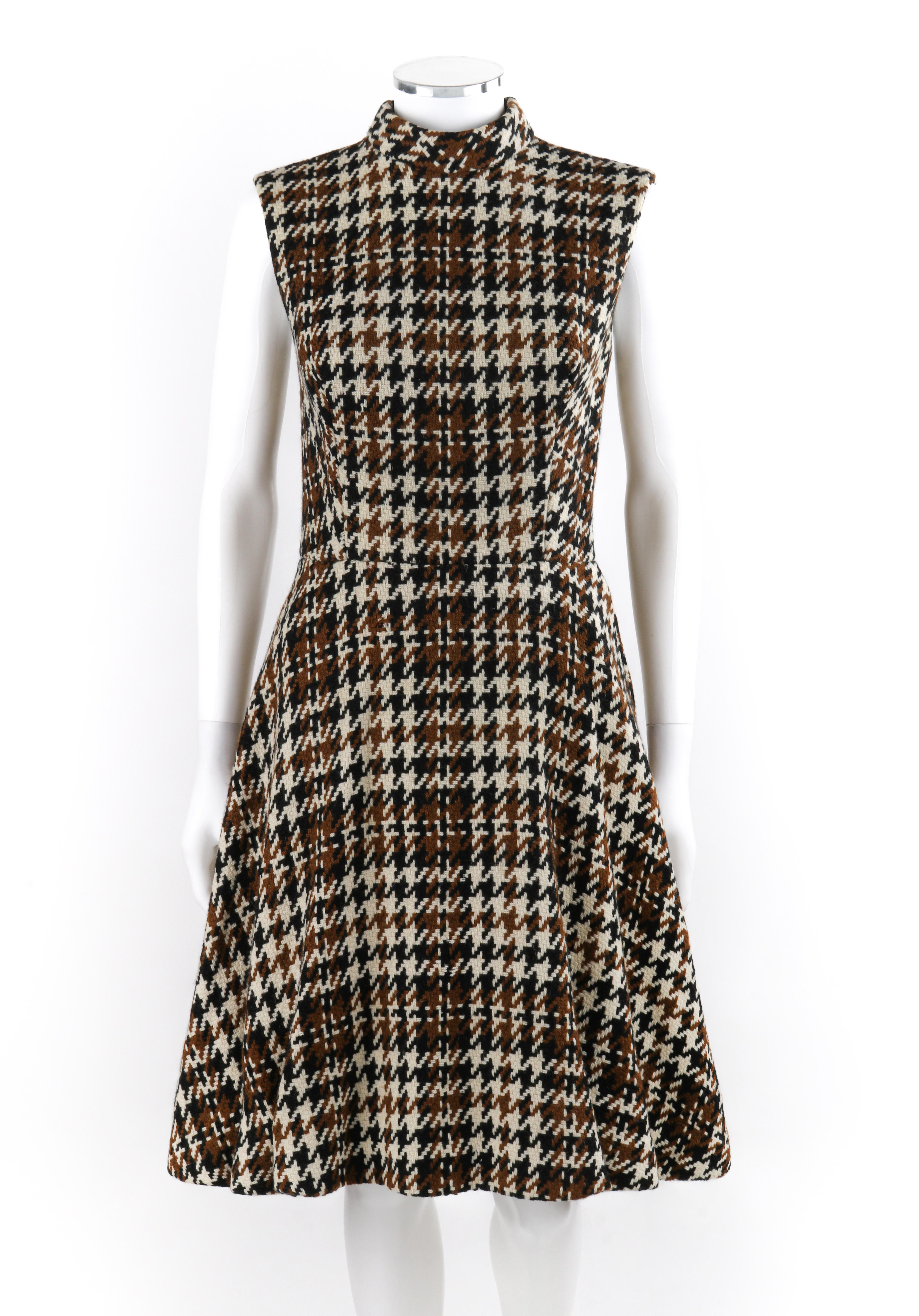 DEBSHIRE ORIGINAL c.1960’s Multicolor Houndstooth Knit A-Line Dress Jacket Set
Circa: 1960’s 
Label(s): Debshire Original
Style: Dress and jacket set
Color(s): Shades of brown, cream, black
Lined: Yes
Unmarked Fabric Content (feel of): Shell: Wool;