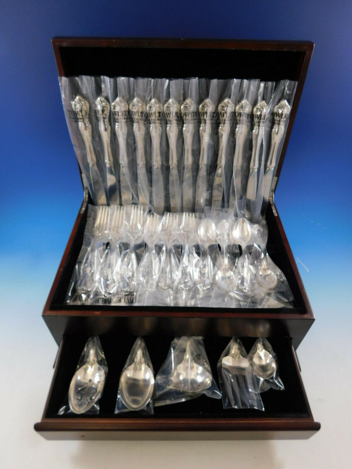 New, unused dinner size debussy by Towle sterling silver flatware set, 53 pieces. This set includes:

12 dinner knives, 9 1/2