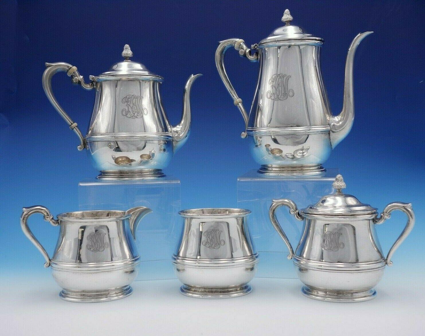 Debutante by Richard Dimes

Stunning Debutante by Richard Dimes sterling silver 5-piece tea set. All the pieces are marked with #81. This set includes:

1 - Coffee pot: Measures 8 3/4