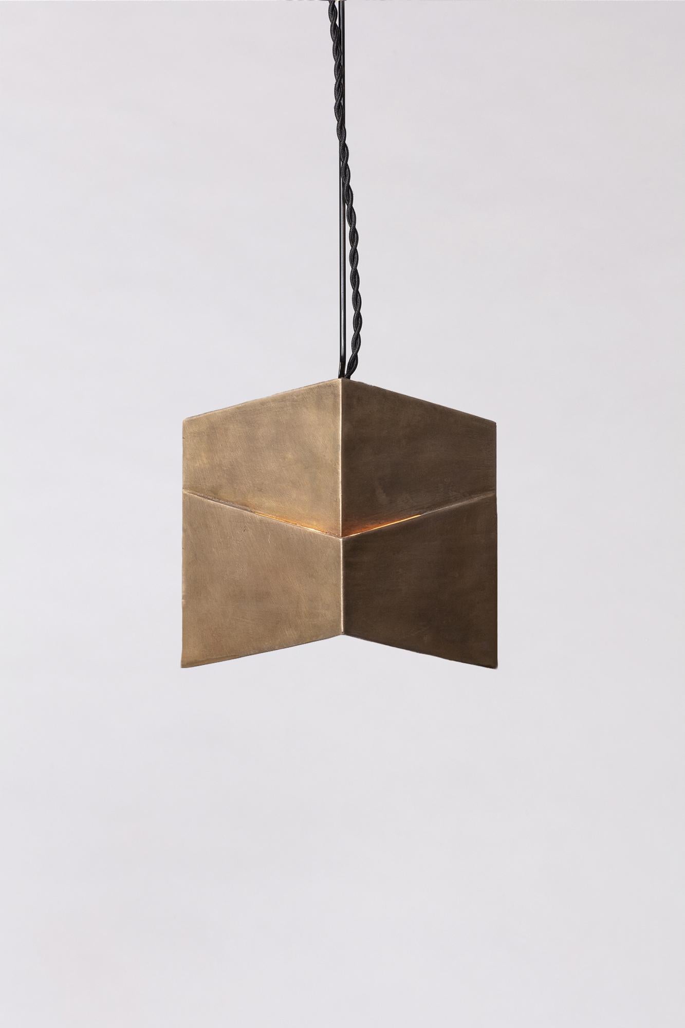
The Decade is a solid brass pendant made with the lost wax casting technique by a local foundry. It is reminiscent of the California architecture of Rudolf Schindler and that of the Bauhaus. Indoors or outdoors, wired with a twisted natural or