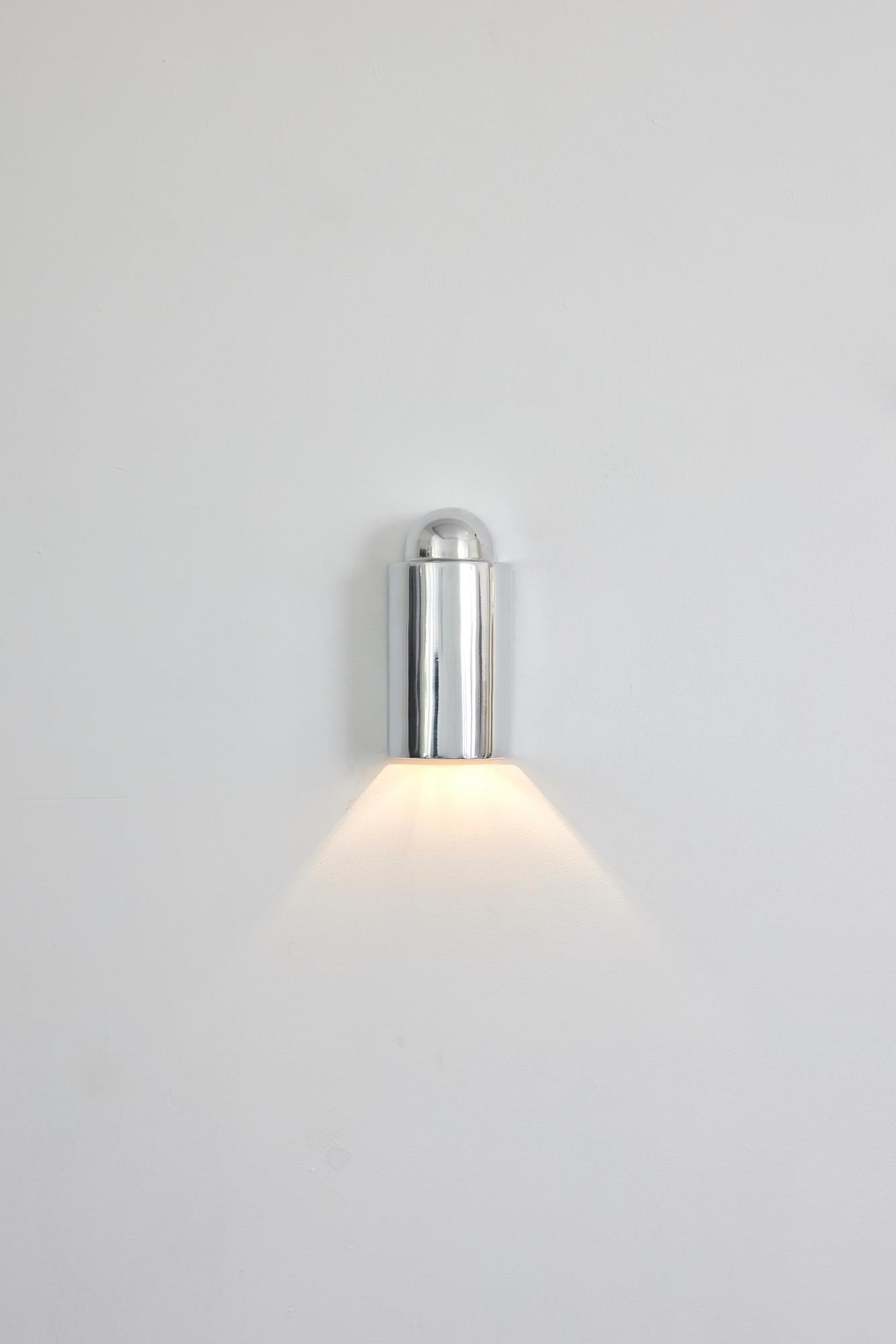 Crafted in Sydney, Australia by Dunlin, The Decade Wall Light is a true embodiment of sophistication, making it a perfect choice to welcome your guests in style as a front door light. Its robust design boasts versatility and is perfect for creating