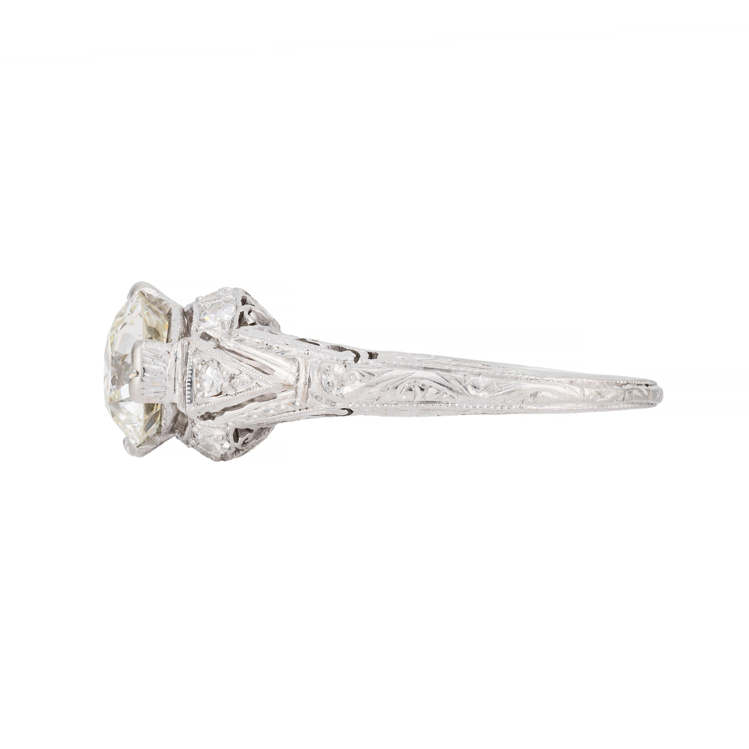 Aston Estate Jewelry Presents:

An exquisite engagement ring featuring a central Old European cut diamond of 1.8 carats, H color, VS2 clarity. Accented by round diamonds totaling 0.12 carats, also of H color, VS2 clarity.  Featuring pierced filigree
