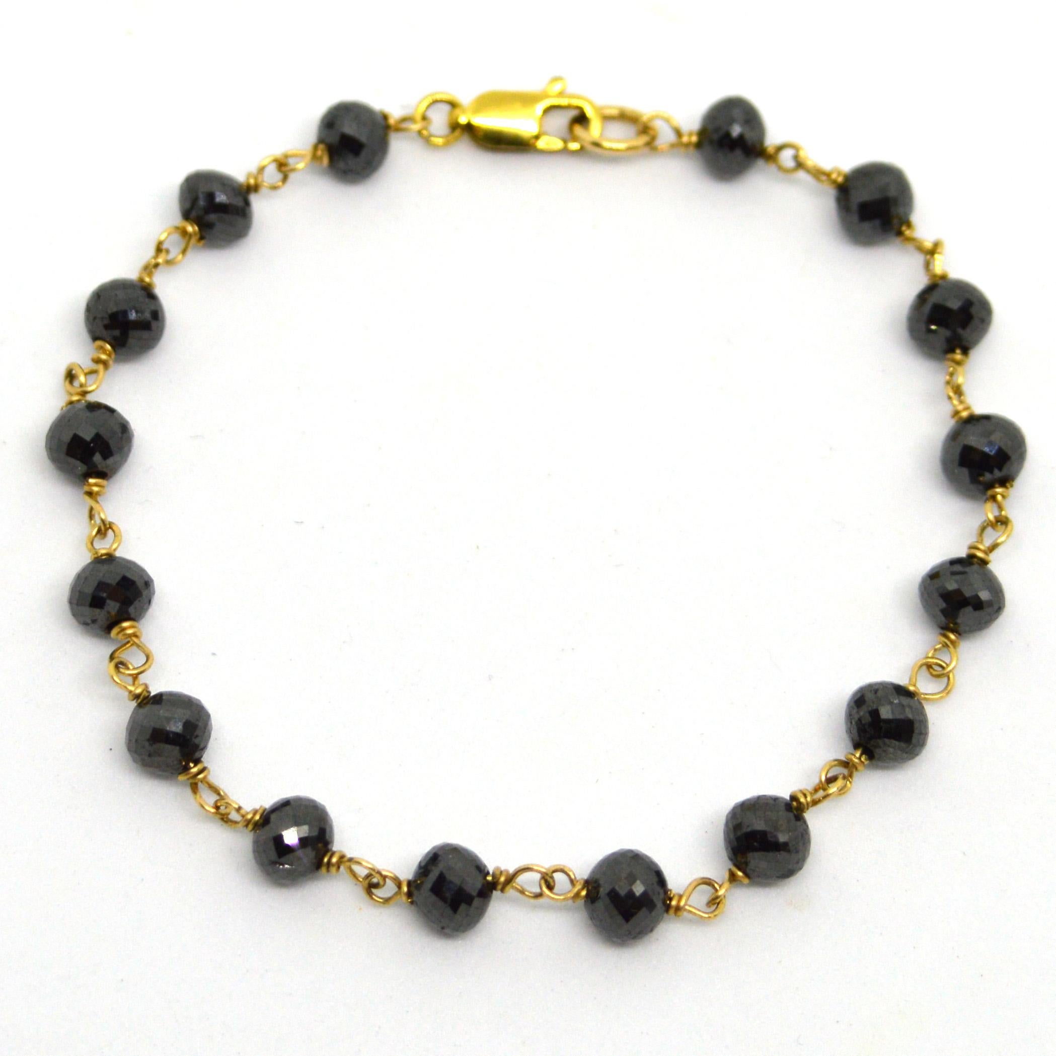 Superior multi-faceted 16 x 1ct Black Diamond hand made bracelet, each stone measures approx 5.6 x 5mm and has a beautiful sparkle.  Hand wire wrapped on 14k gold filled wire for strength with a 14k Gold filled clasp.
Finished Bracelet measures