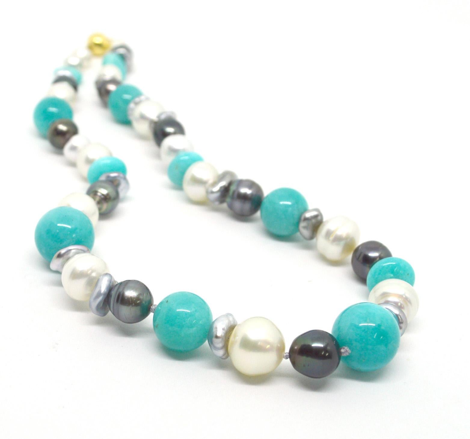 Adorn your neck in luxury with the soft tones of Peruvian Amazonite with creams whites and greys Pearls. A mix of baroque Australian South Sea and Tahitian Pearls ranging from 9mm to 13.7mm.
Necklace 50cm in length. Hand knotted on soft grey