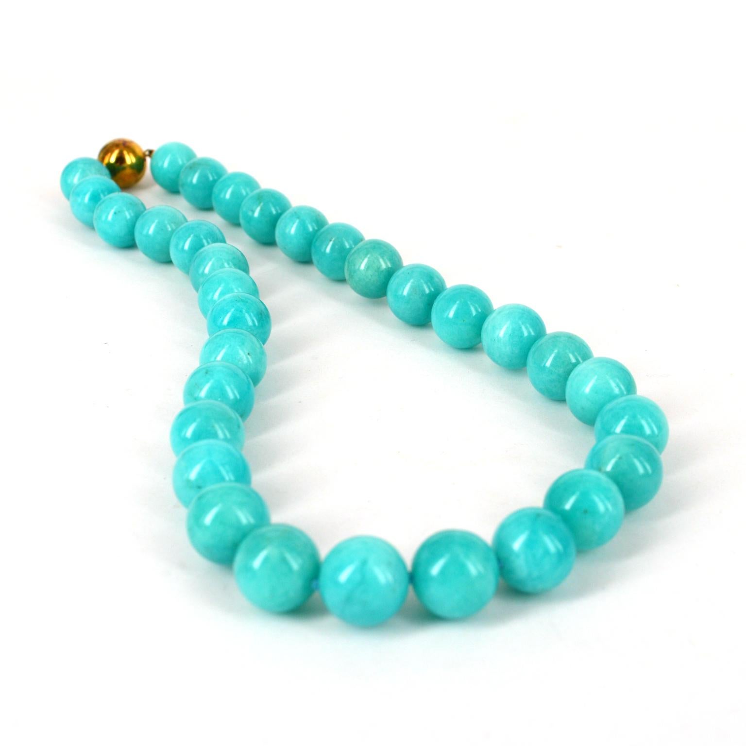 Bold and fun this beautiful blue/turquoise stone is naturally coloured, hand knotted AAA quality 14mm Peruvian Amazonite necklace with a 14mm  finished with Gold plate Sterling Silver  clasp 
Total length of necklace 49cm.

