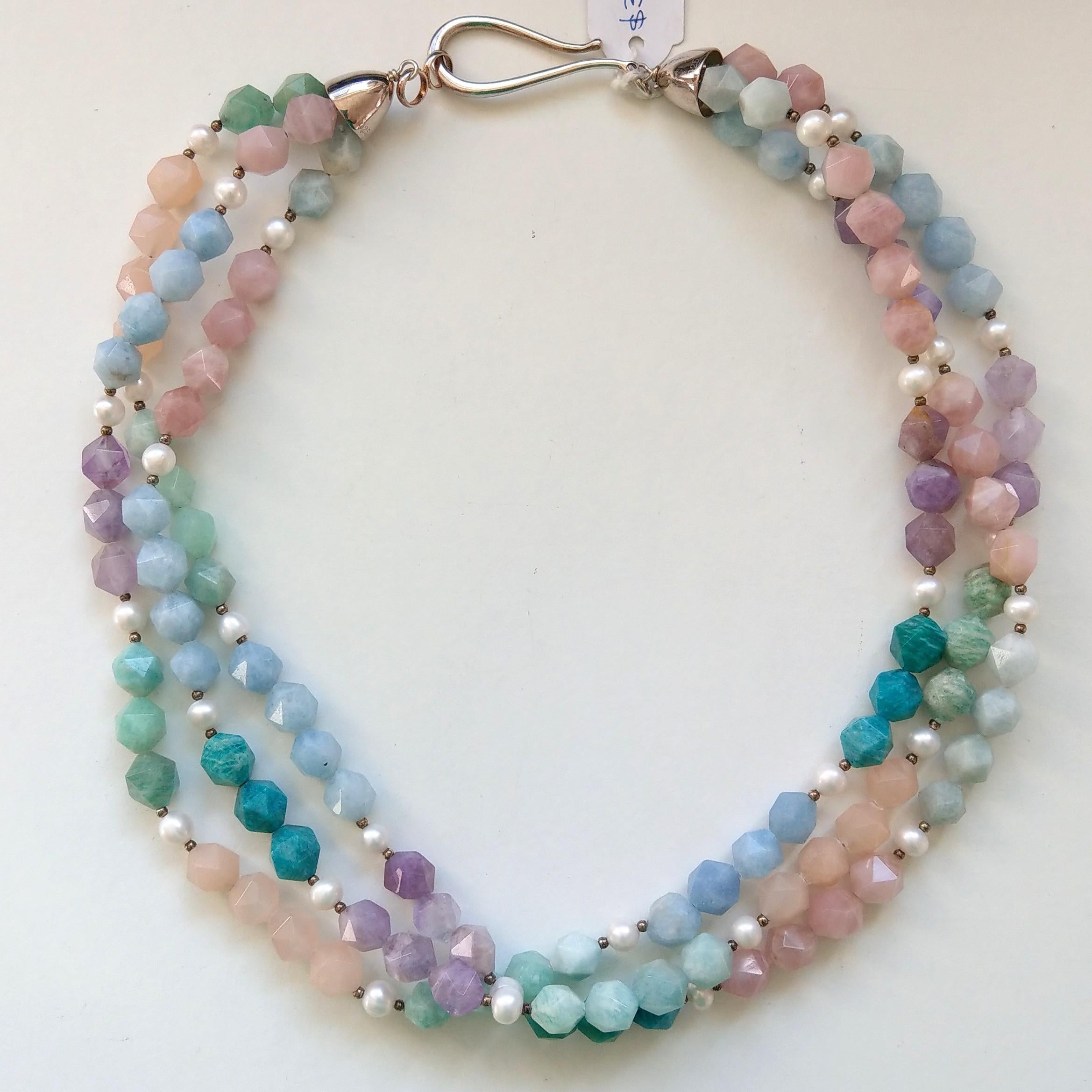 beautiful 3 strand necklace with 8mm Star cut Amazonite, Russian Amazonite, Pink Morganite, Blue Lace Agate, Amethyst and 6mm Fresh water Pearls, Sterling Silver, 2mm beads, caps and hook Clasp.

Finished necklace measures 52cm  NOT twisted.





