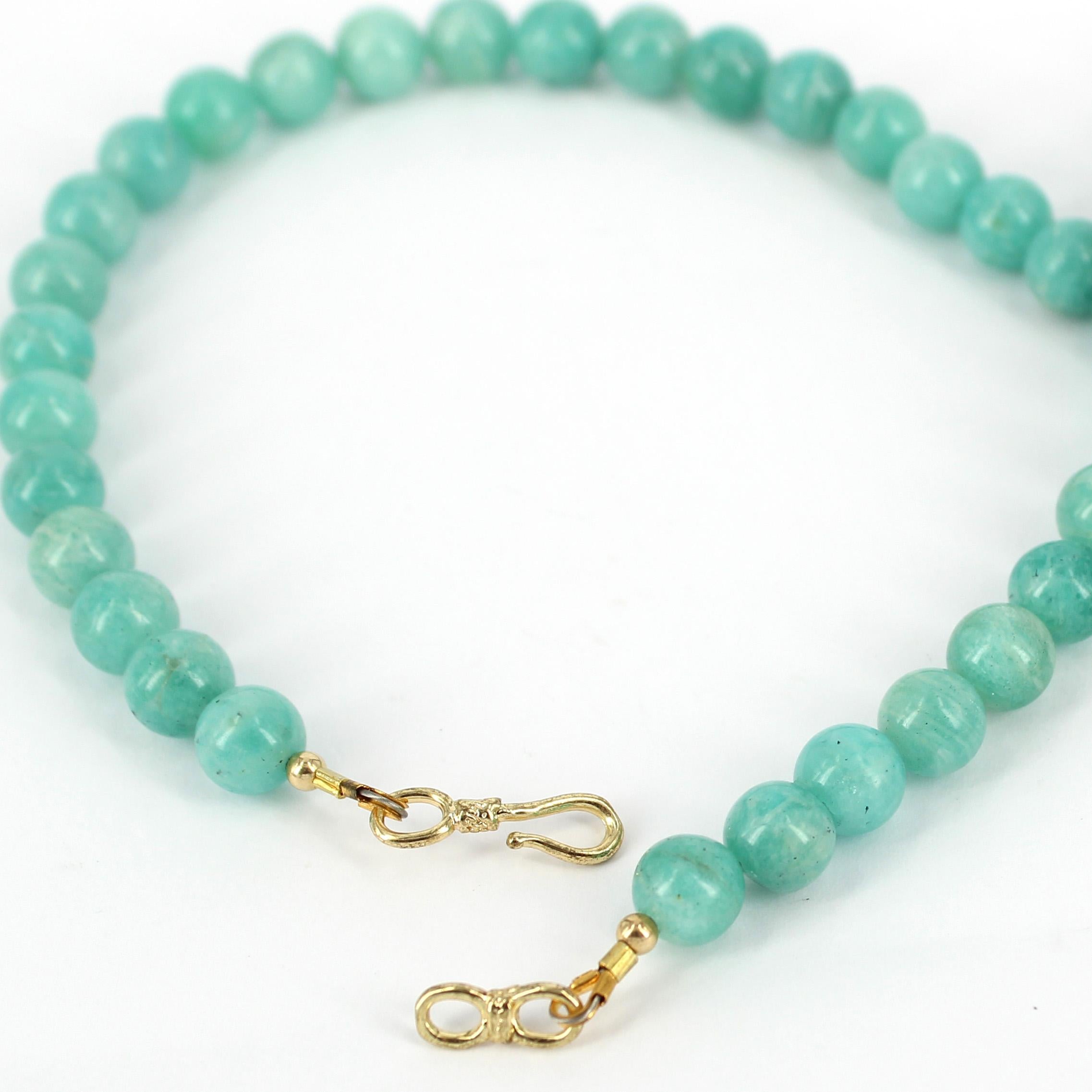 gold necklace with turquoise stone