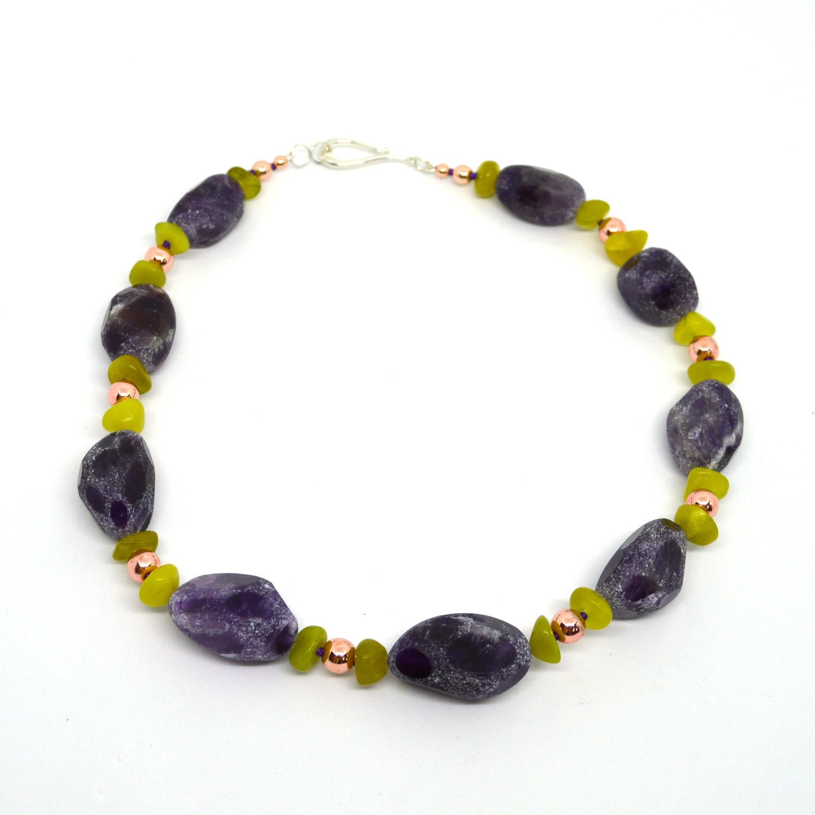 Amethyst Acid Polished Nugget approximately 25mm beads with Korean Jade nuggets and rose gold plated hematite. Hand knotted on purple thread 40mm Sterling Silver hook Clasp.

Finished necklace measures 51cm.







