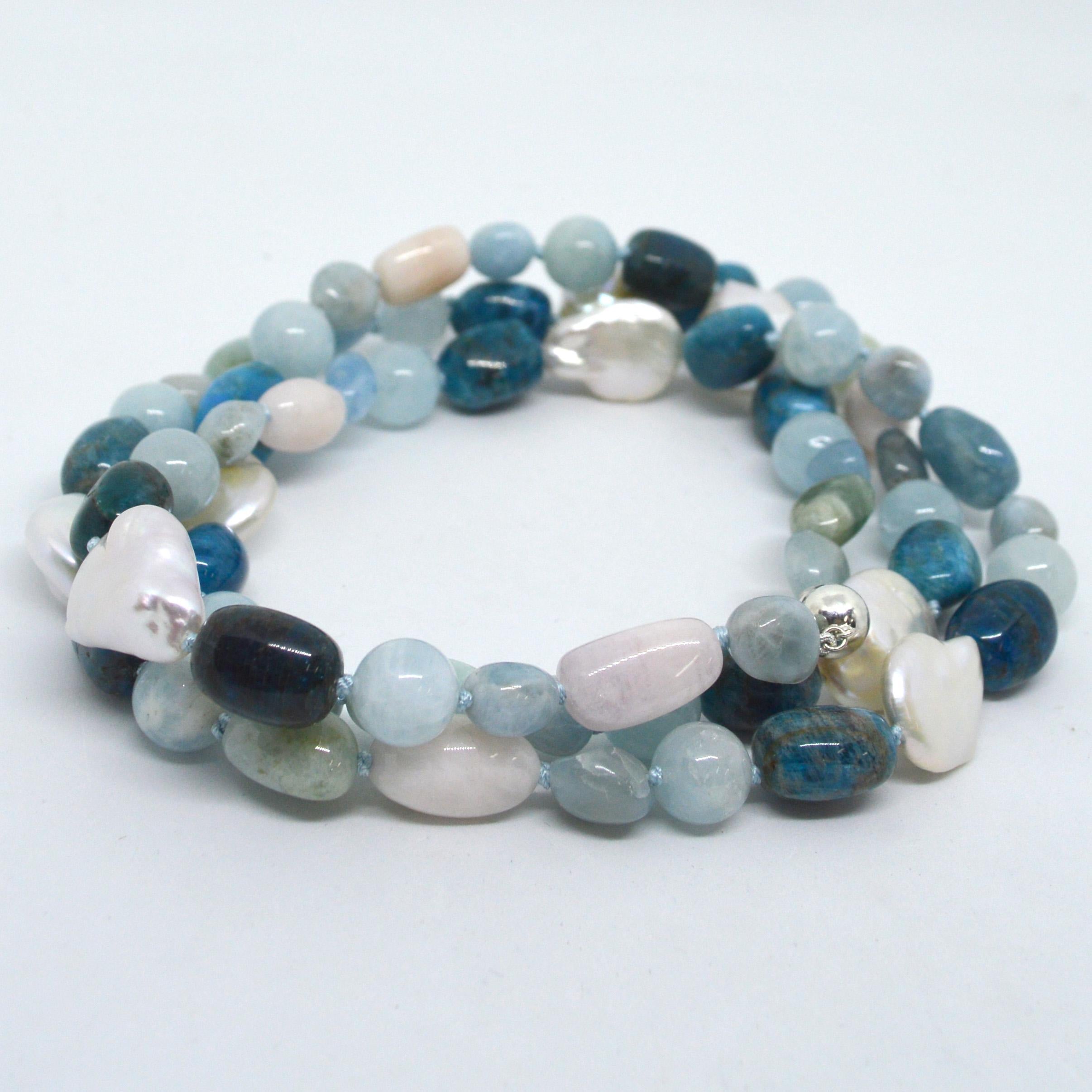 Beautiful Shades of Blue with a hint of pink make this lovely long necklace. 12mm Polished Aquamarine, approx 14mm Beryl  (multi-Colour Aquamarine and Morganite) nuggets, 16x12mm Bright blue apatite and 21mm plus Baroque Fresh Water Coin Pearls with