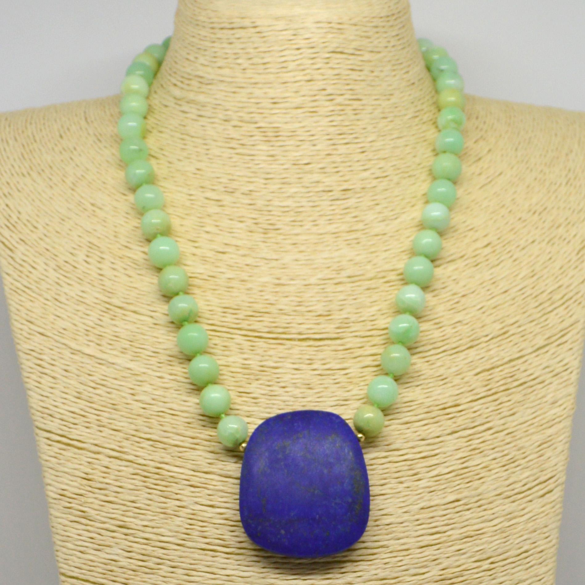 Soft green Australian Chrysophase beads 10mm with a stunning matt natural Lapis Lazuli oval pendant, 3mm Round Gold filled beads with a 55mm Gold Plate Sterling Silver Hook clasp, hand knotted for strength and durability.

Finished necklace measures