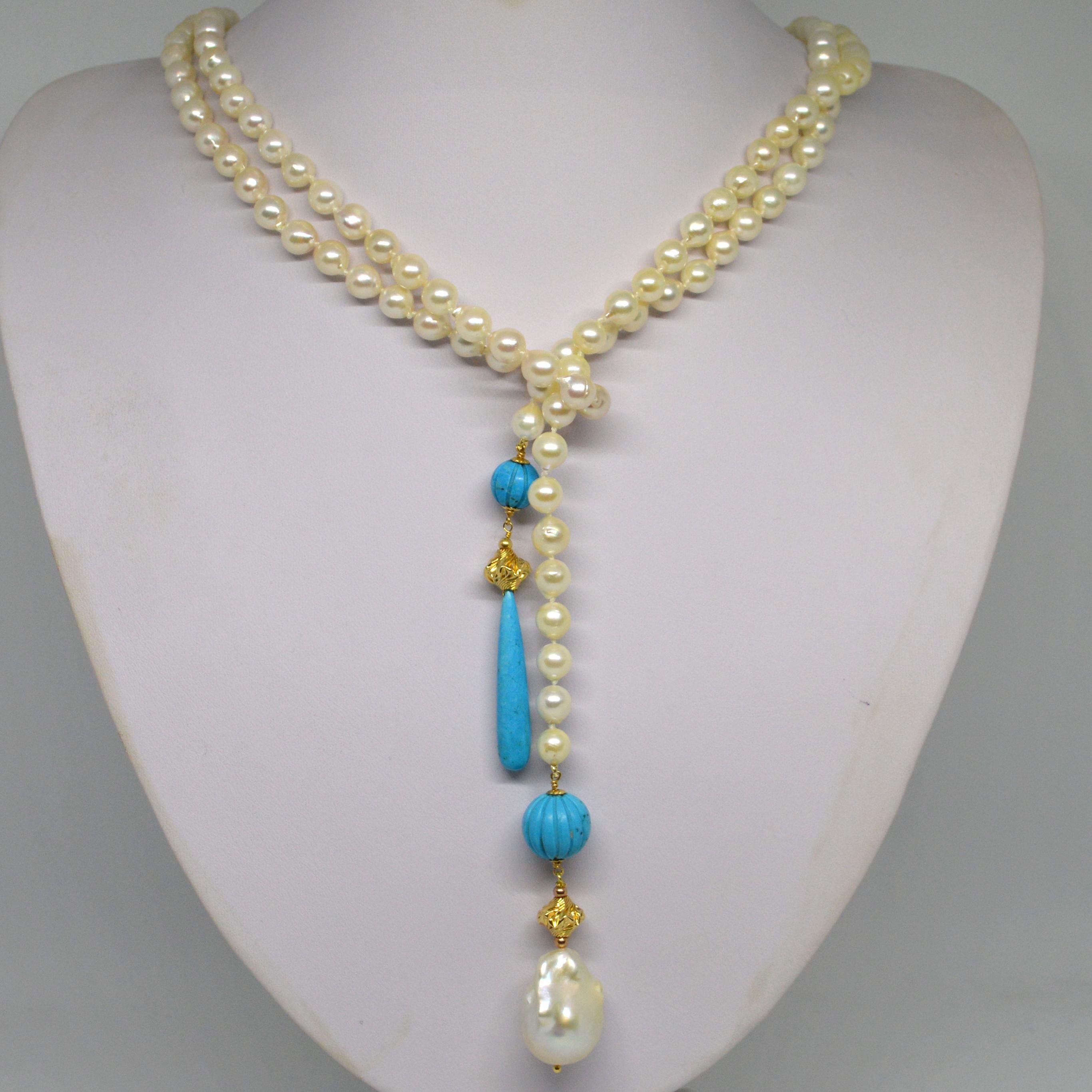 Versatile scarf style lariat necklace with 7-7.5mm Akoya Pearls with Carved Turquoise round 10 and 14mm round beads, large 24x16mm Baroque Fresh Water Pearl, hand knotted for strength and durability.

Total length 1.4m 55 inches