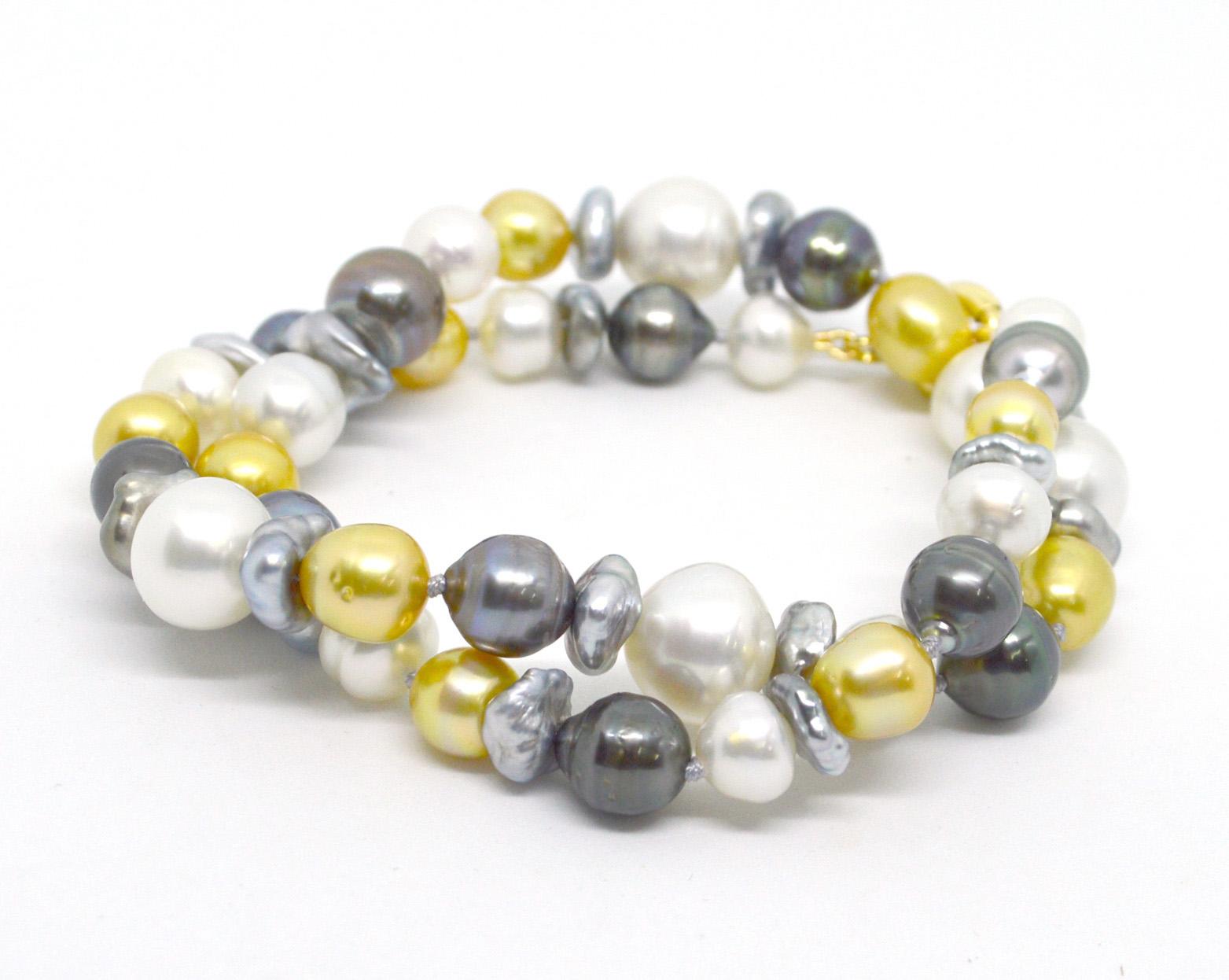 Adorn your neck in luxury with soft tones of creams, whites, gold, and greys. A mix of baroque Australian South Sea and Tahitian Pearls ranging from 10mm to 14mm.
Necklace 51cm in length. Hand knotted on soft grey thread.

All Pearls are natural and