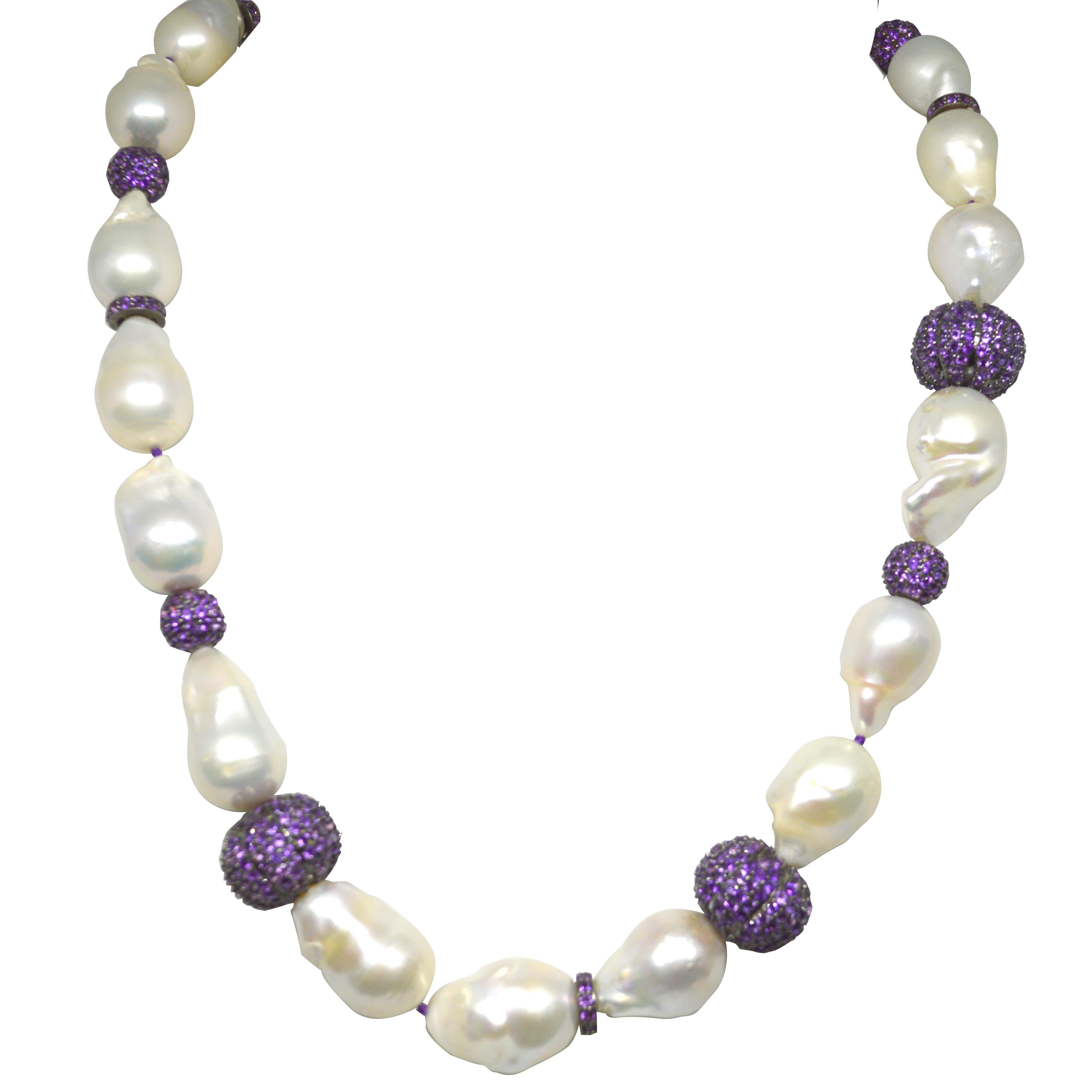 Stunning large Baroque Fresh Water Pearls with random Pave Amethyst & Sterling Silver beads. Pearls range from 22mm up to 28.7mm long and the Pave Amethyst beads are 10mm round 10x3mm rondel and 15x18mm melon shape.
Hand knotted on purple thread