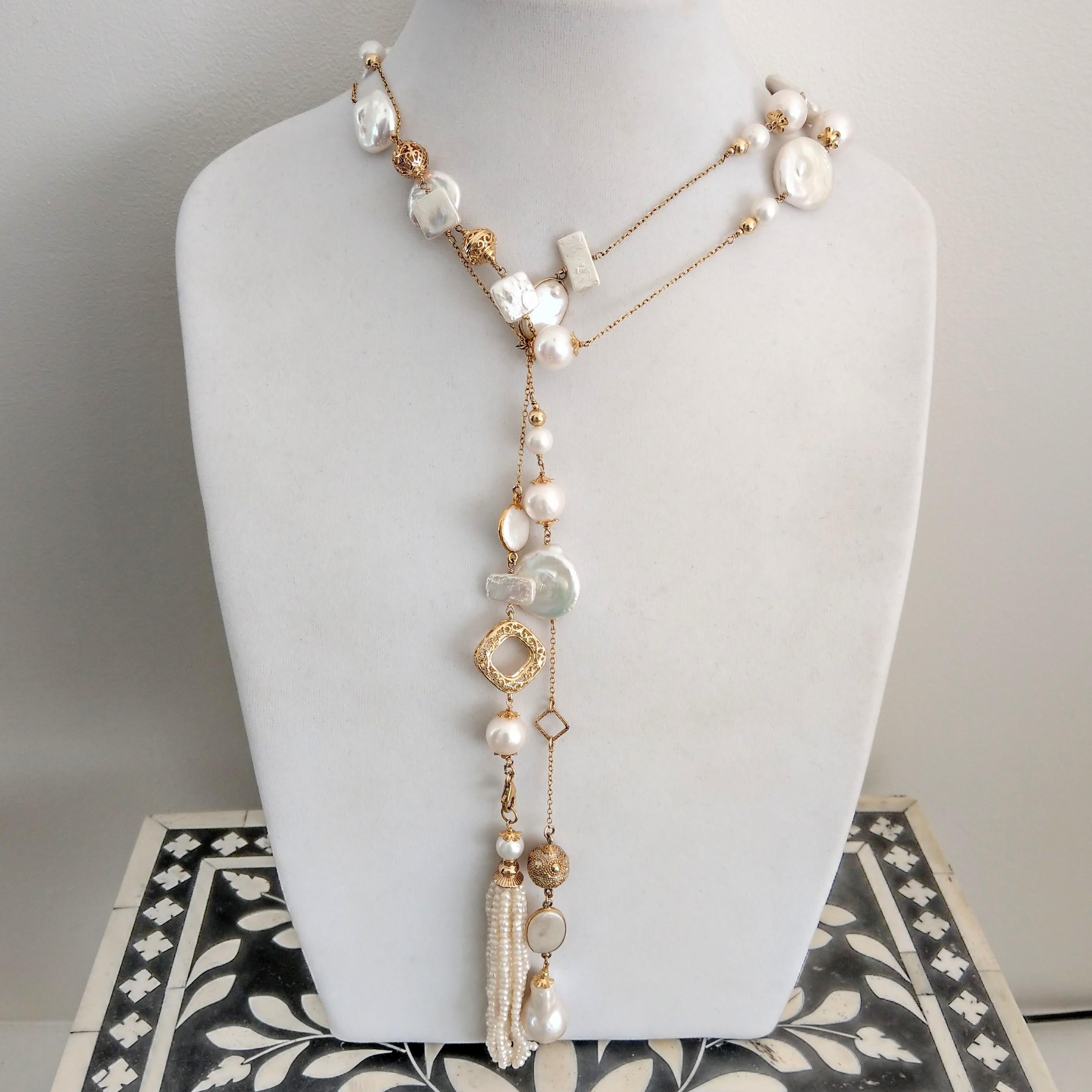 Multi wear stunning 14k Gold filled long chain necklace with Freshwater Pearls with a removal 100mm fresh water pearl tassel 
Wear as a lariart
long necklace with tassel
double standed
15x 23mm Baroque Pearl
20x23mm Coin Pearls
12-13.5mm Round