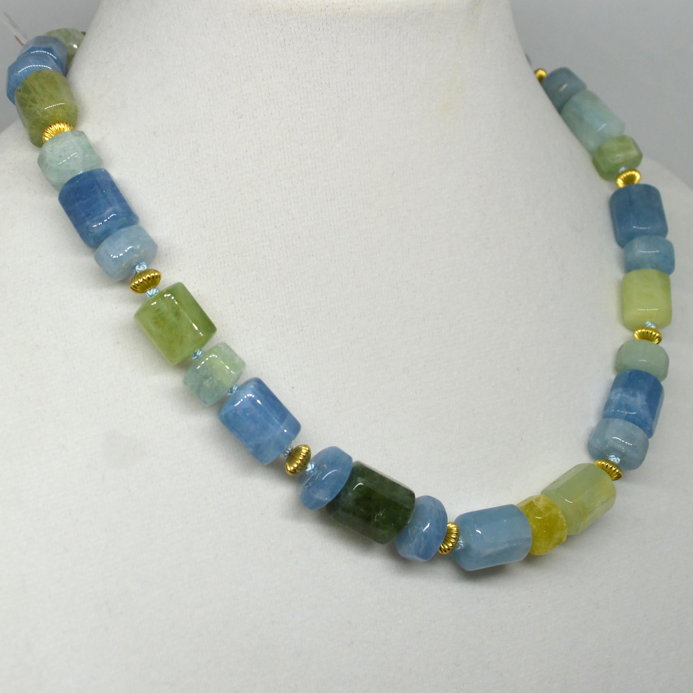 Blue and Green aquamarine tubes 10mm thick spaced with corrugated 6mm 14k Gold Filled beads and finished with a 10mm Vermeil (Gold plate Sterling Silver) clasp. Finished necklace measures 43.5cm.

Custom modification available on request

 