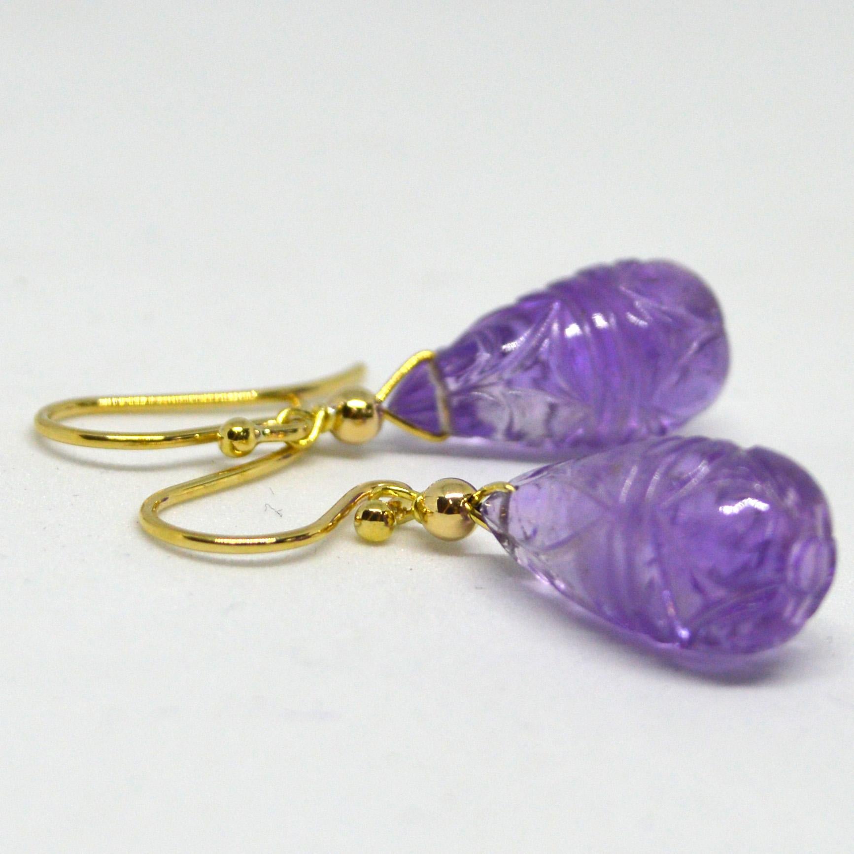 Natural 18mm Carved Amethyst on 9ct yellow Gold Sheppard,  14k Gold wire and 3mm round bead.

Total Earring length 36mm.