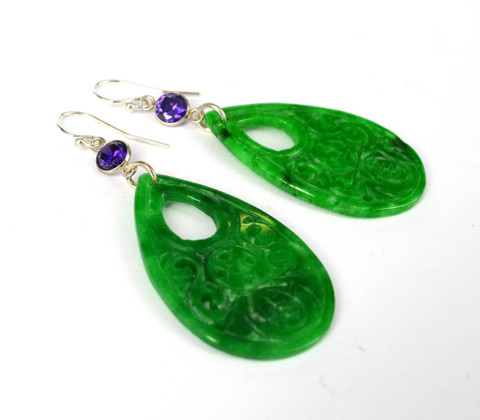Carved Jade earrings with Sterling Silver Amethyst CZ connectors.
Jade is 25mm wide and 40mm long.
Earring hangs at 69mm 