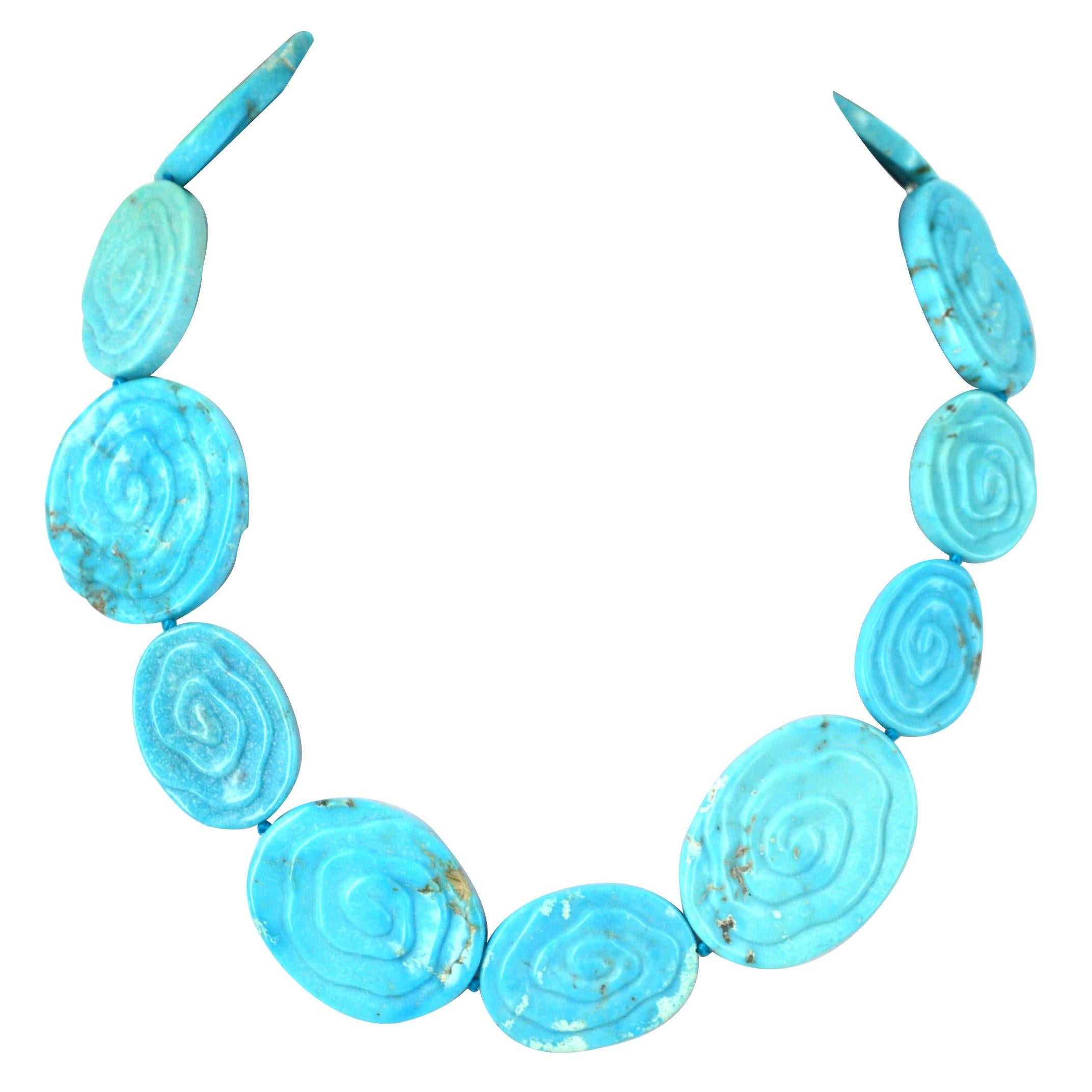 Unique carved Chinese Turquoise bead necklace, beads range from 19x27mm up to 40x30mm, hand knotted Sterling Silver hook clasp 
Total length of necklace 47.5cm.

