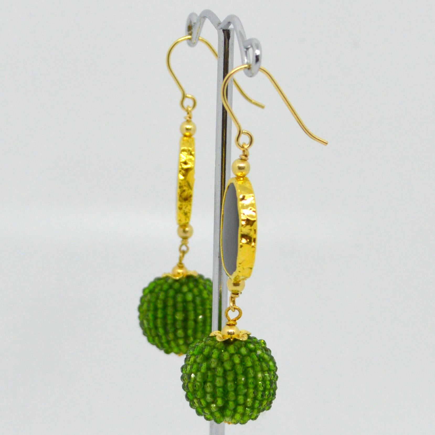 Gold plate Sterling silver  Onyx slice 12x15mm with a hand made beaded bead of Chrome Diopside mirco faceted beads 14k Gold Filled headpin and 3mm beads and Sheppard.

Total Earring length 55mm.
