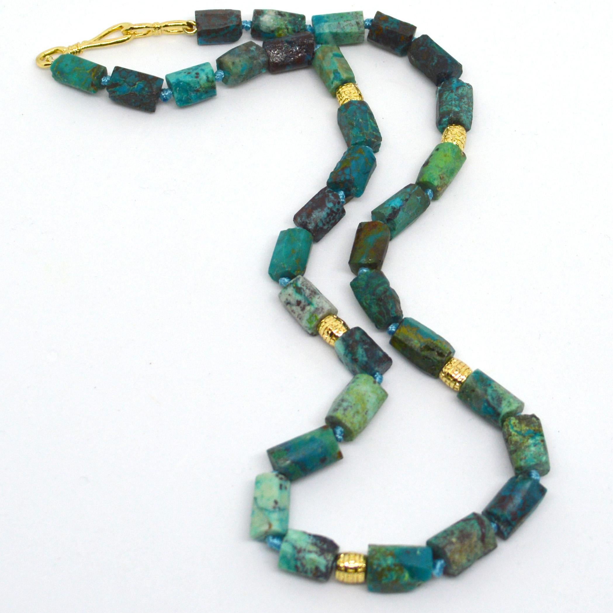 Chrysocolla rough faceted tubes approximately 12x6mm with Gold plated tube beads and hook clasp
Hand knotted for strength and durability 
Finished necklace is 48cm.


