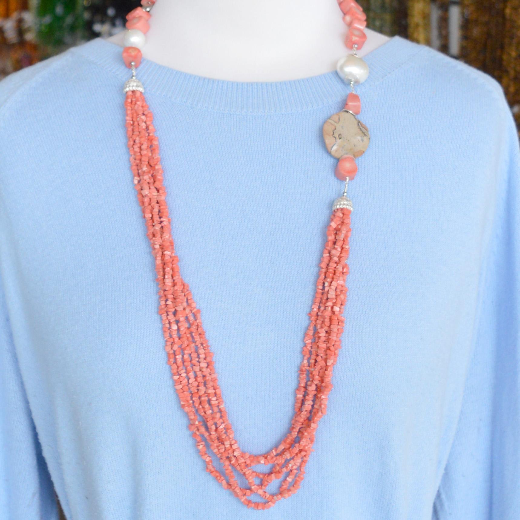 Turn a basic outfit into something more and create a lasting style statement you’ll reach for all season long. African Leopard Skin Jasper adds an earthy tone to this apricot Sea Bamboo Coral, Silver and Shell Pearl necklace.  Silver plate Copper