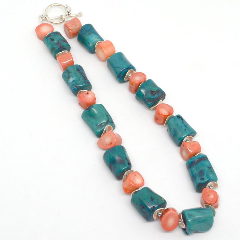 Light Summer colours of teal and apricot, teal Sea Bamboo Coral tubes with Apricot coral slices. Silver plate Copper Clasp and spacer beads

Finished necklace measures 44cm.






