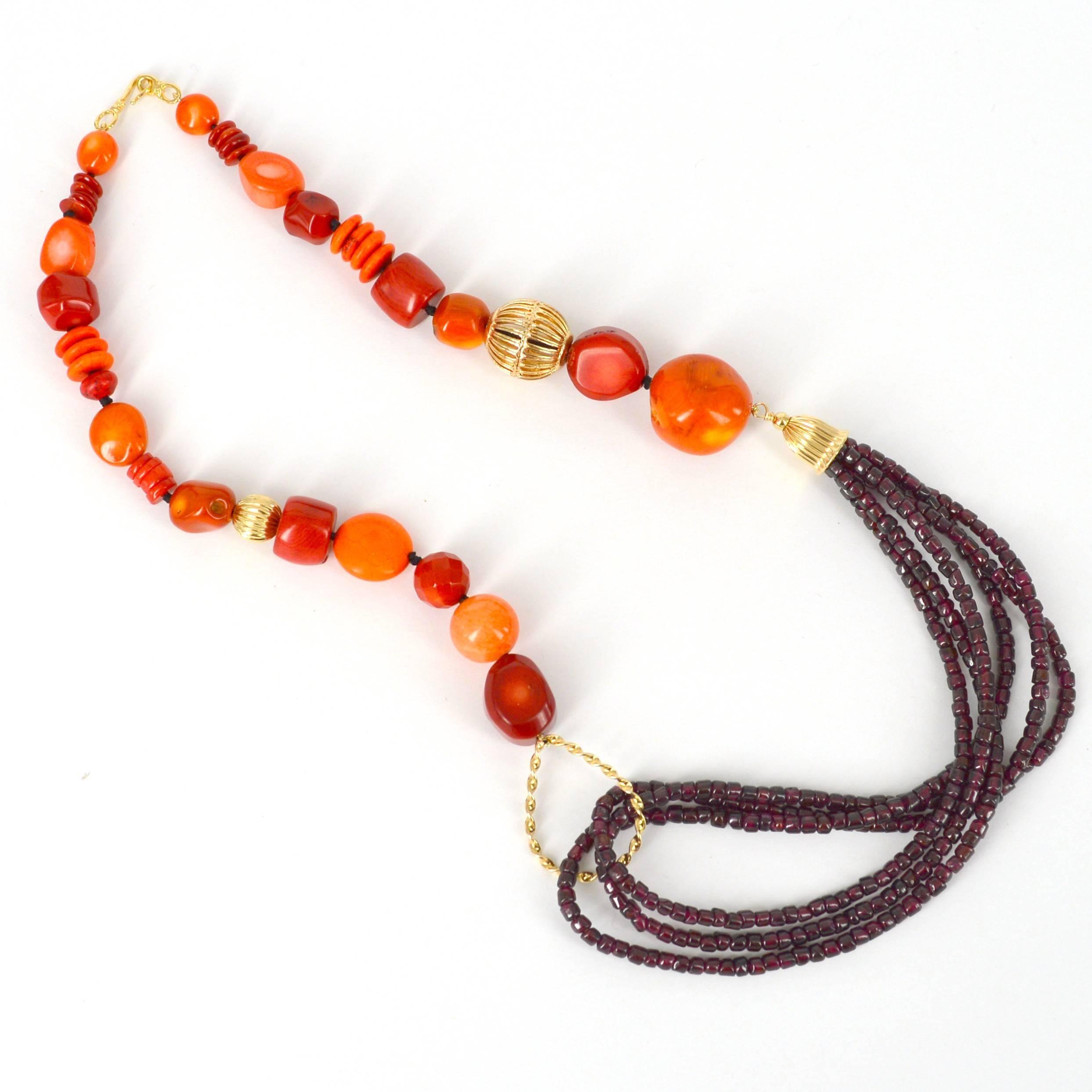 Vibrant Eye catching Necklace with Draped Garnet Flowing from Orange and Red Sea Bamboo and Howlite Beads with 14k Gold Filled Feature Beads. Sea Bamboo Beads have been knotted for strength and durability on black thread.
Necklace is finished with