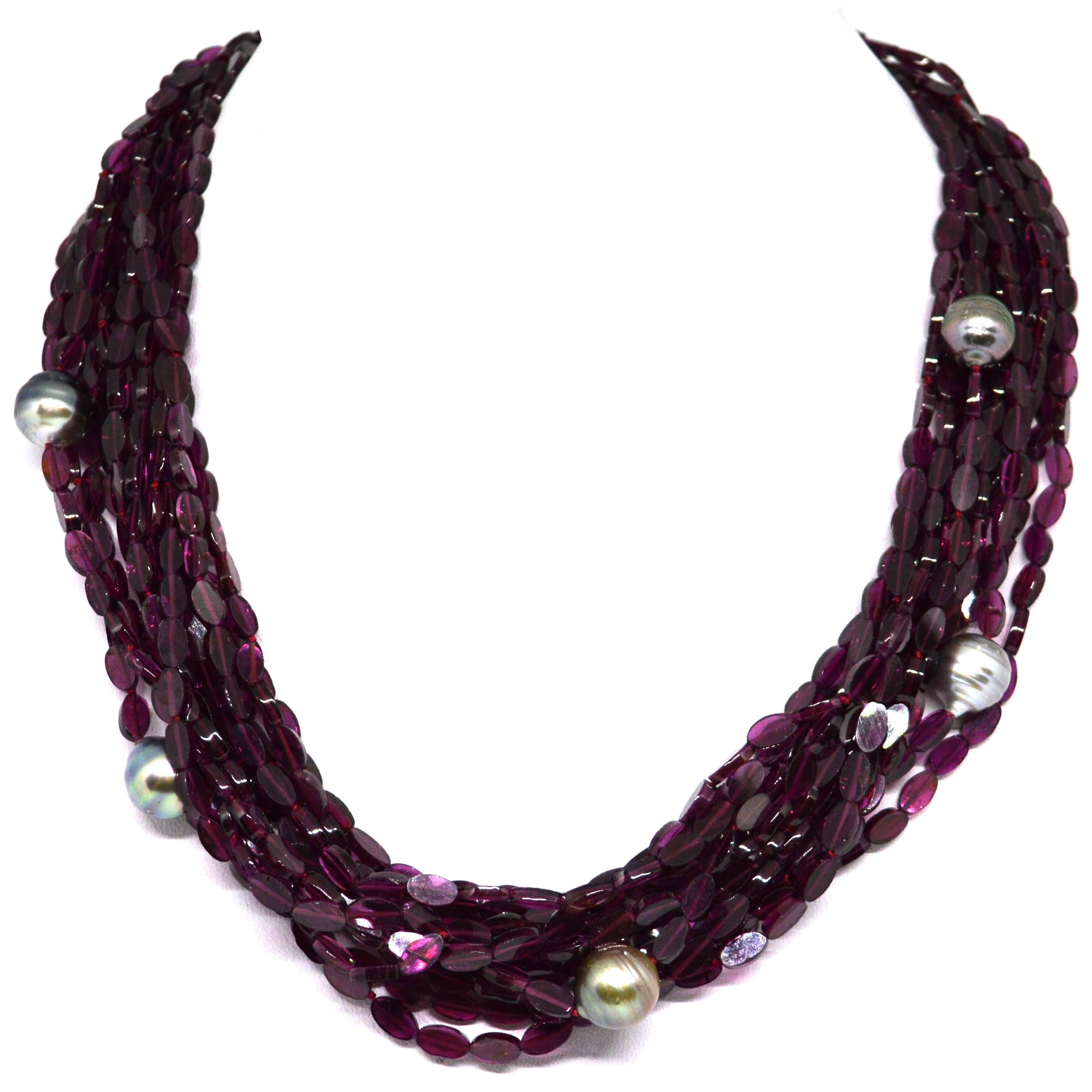 13 Strands of Oval shaped Garnet with 5x10mm Natural Tahitian Pearls, Necklace is finished with Gold Plate Sterling Silver Caps, Chain and Hook Clasp. 
Hand knotted for strength and durability on Dark Red Thread.

Finished Necklace measures 46-54cm