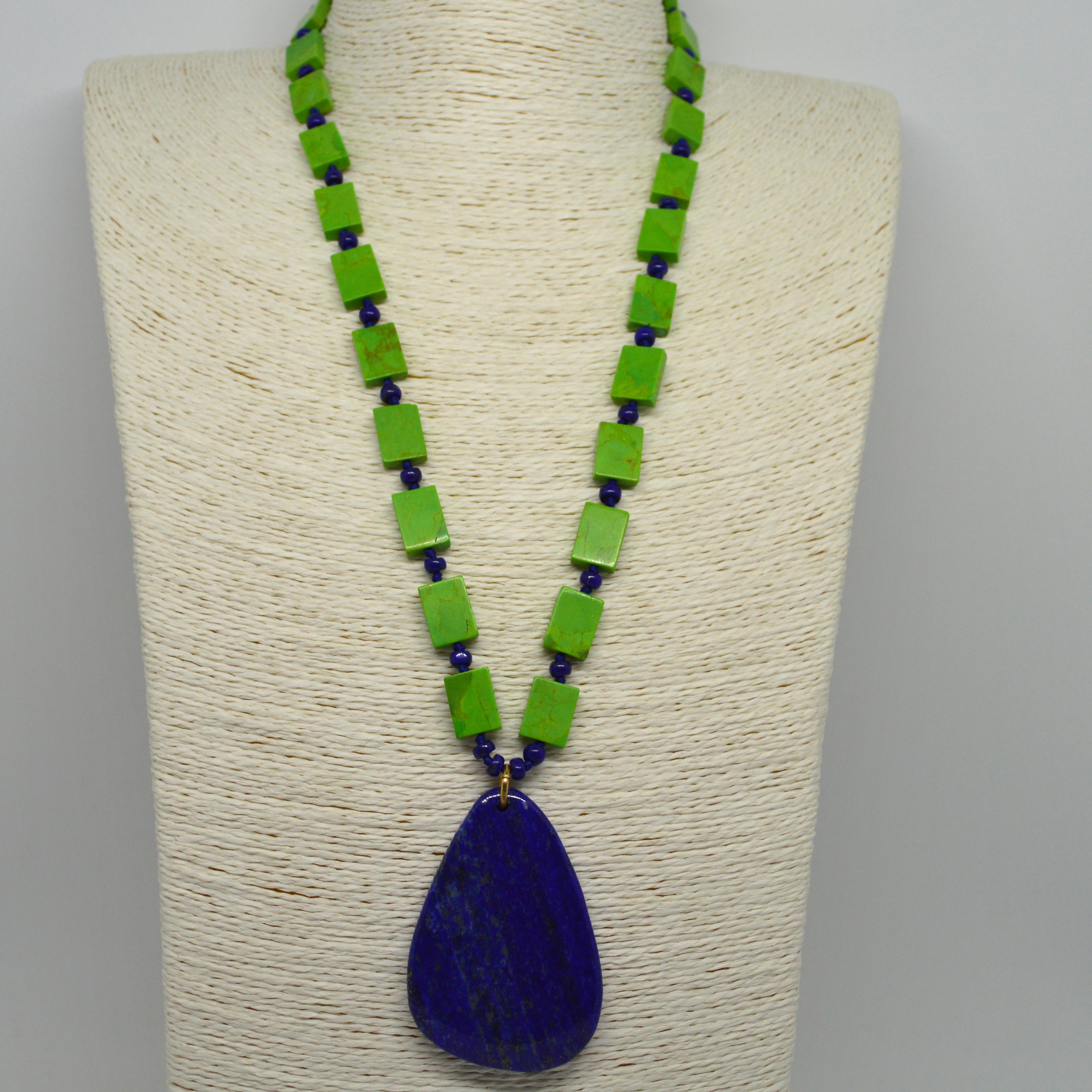 High grade vibrant Lime Green Mojave Turquoise the rarest variety of Natural Turquoise. Necklace is comprised of rectangles of 10x14mm Mojave Green Turquoise spaced by natural 4x5mm Rondel Lapis Lazuli beads, with a large free form Lapis Pendant