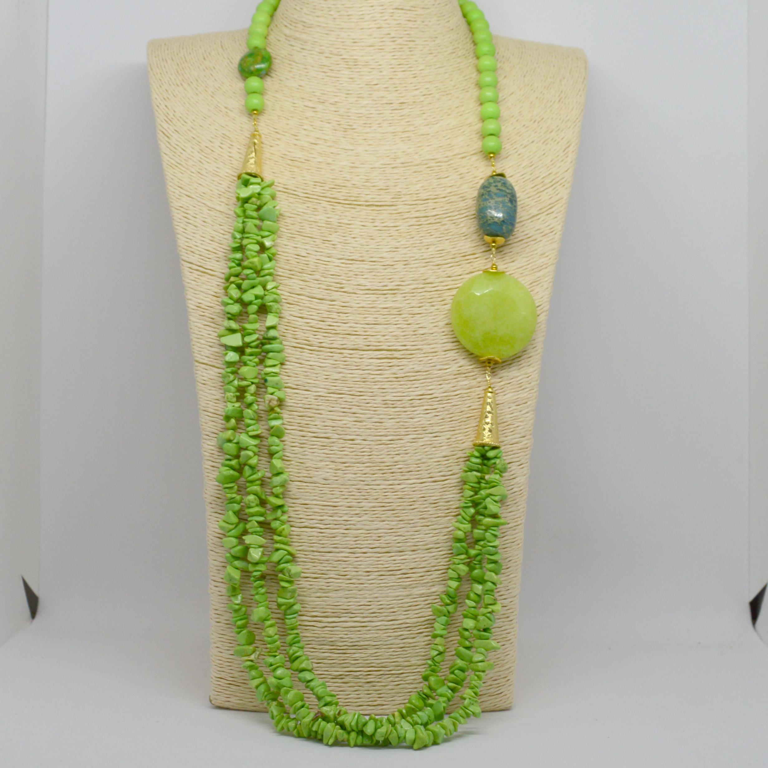 Turn a basic outfit into something more and create a lasting style statement you’ll reach for all season long. 
Bright and Cherry lime green howlite, Blue Impression Jasper,Gold and large lime Jade bead necklace.  Gold plate Copper cap and spacer
