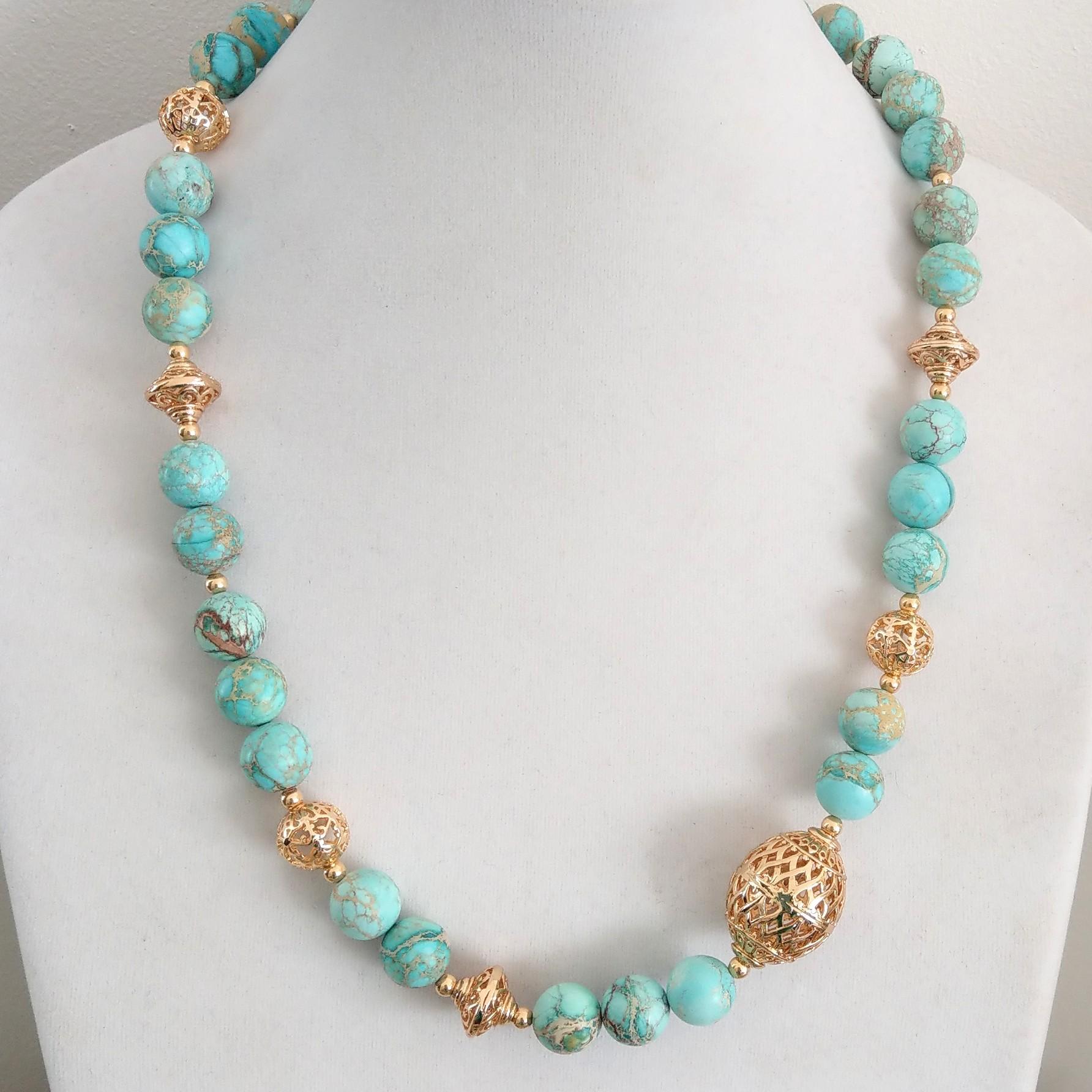 Delicate Blue Impression Jasper matt polished 12mm beads with Statement 14k Gold filled beads.
Necklace has largest bead is 19x28mm with 12mm Filligree round beads and a Gold plate Sterling Silver Hook Clasp 44mm

Finished necklace measures 58cm
