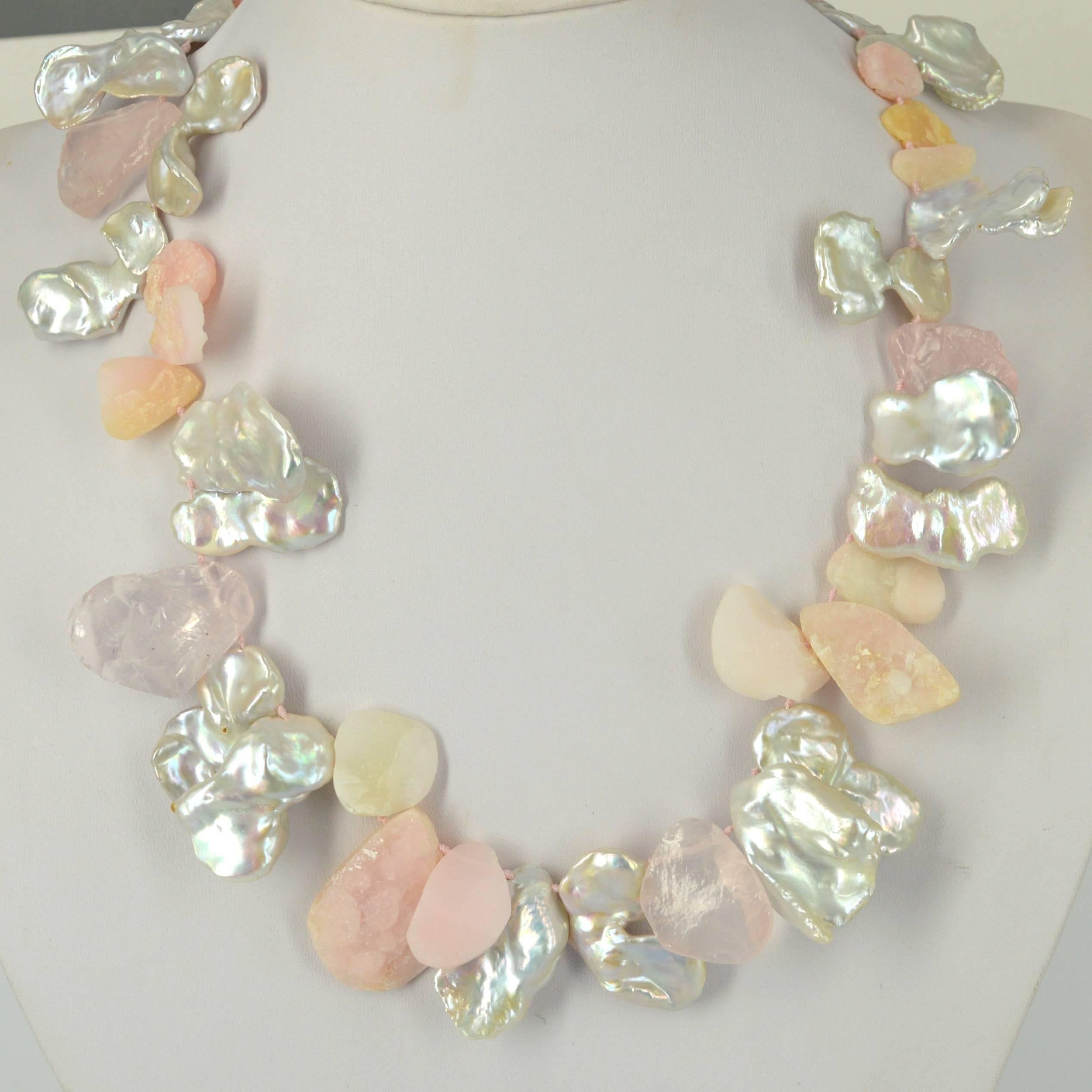 Statement necklace of large Fresh Water Keshi Pearls approx 30mm with Raw top drilled teardrop beads in Rose Quartz and Pink Opal  hand knotted on matching pink thread with a 51mm hook Sterling Silver clasp. 

Finished necklace measures