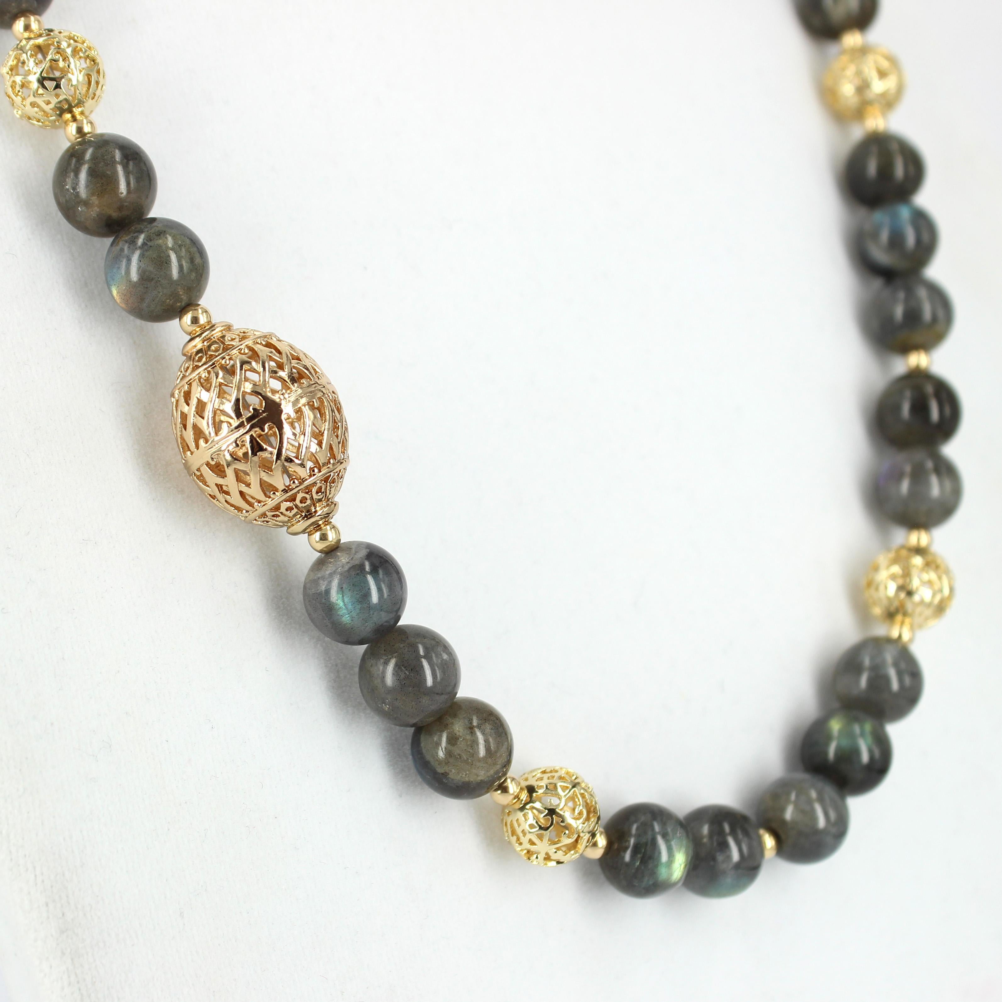 Dress to impress with this elegant statement piece, Natural Labradorite 12mm necklace features 33 polished beads, Gold filled filigree beads ranges,  4mm round, 12mm, round, 26x20mm oval, finished with Sterling Silver gold plated hook clasp. 

Total