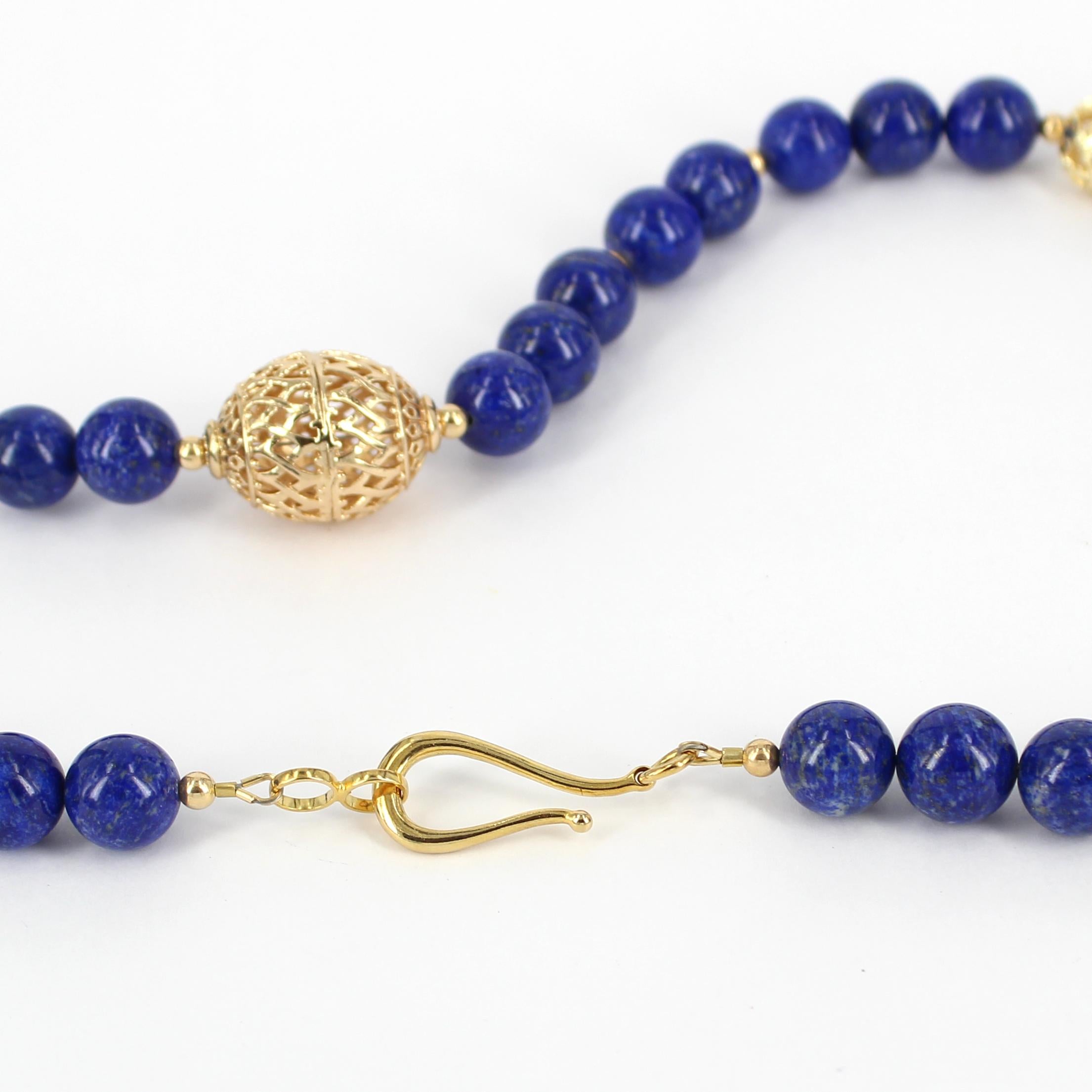 Dress to impress with this elegant statement piece, Natural high grade Lapis 12mm necklace features 33 polished beads, Gold filled filigree beads ranges, 4mm round, 12mm, round, 26x20mm oval, finished with Sterling Silver gold plated hook clasp.