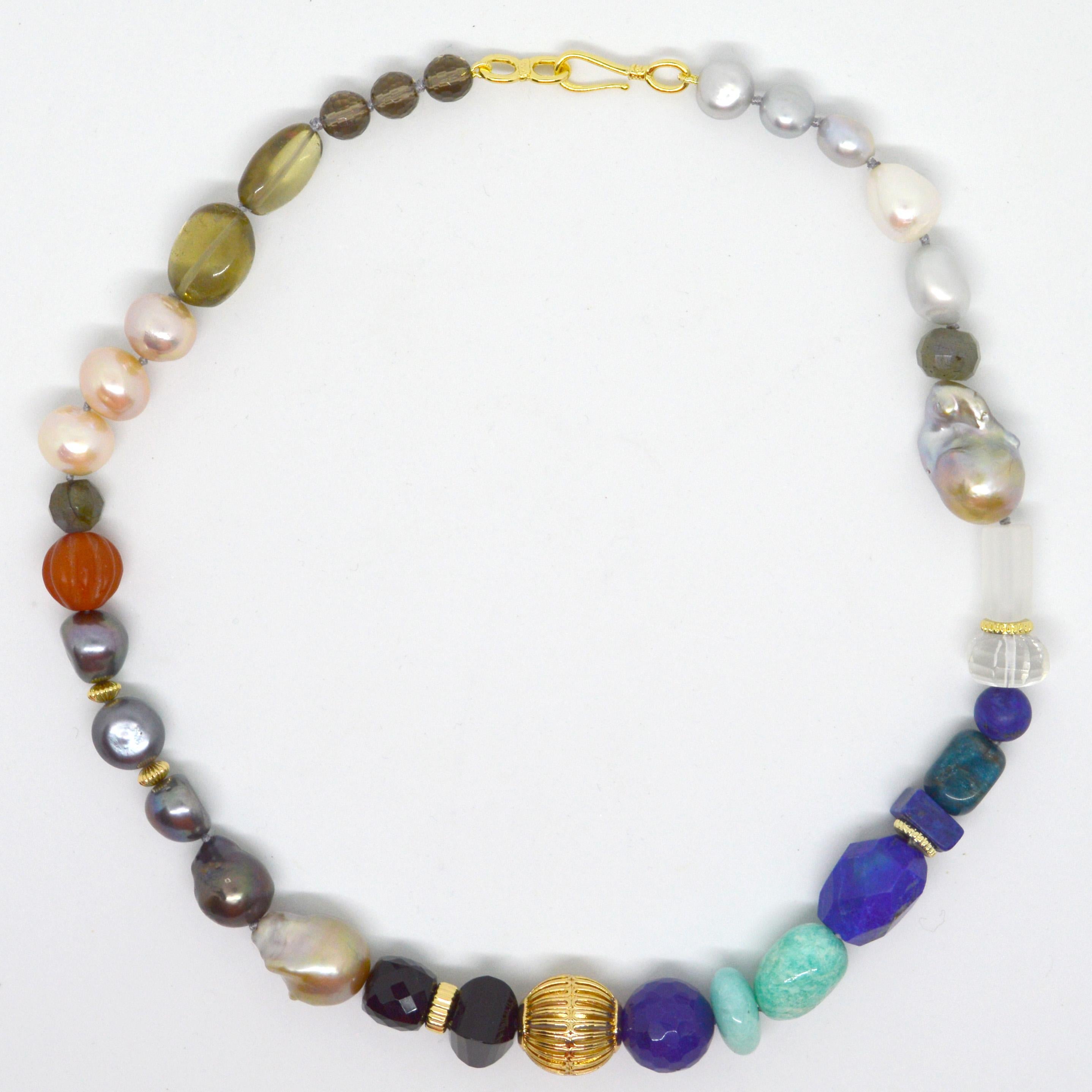 A stunning combination of exotic gemstones, this short strand Multi-gemstone is an effortless way to add style to any look. 
Lapis Lazuli, Amazonite, Labradorite, Carnelian, Onyx, Smoky Quartz, Clear Quartz, Blue Jade, Silver and pink Pearls 