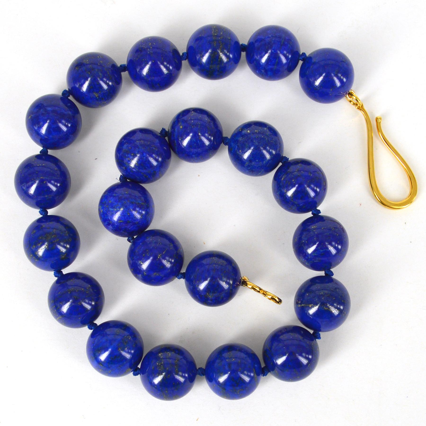 Large 18mm deep blue high quality Lapis Lazuli beads hand knotted on matching thread with a 55mm Gold plate Sterling Silver hook clasp 
Total length of necklace 49cm.


