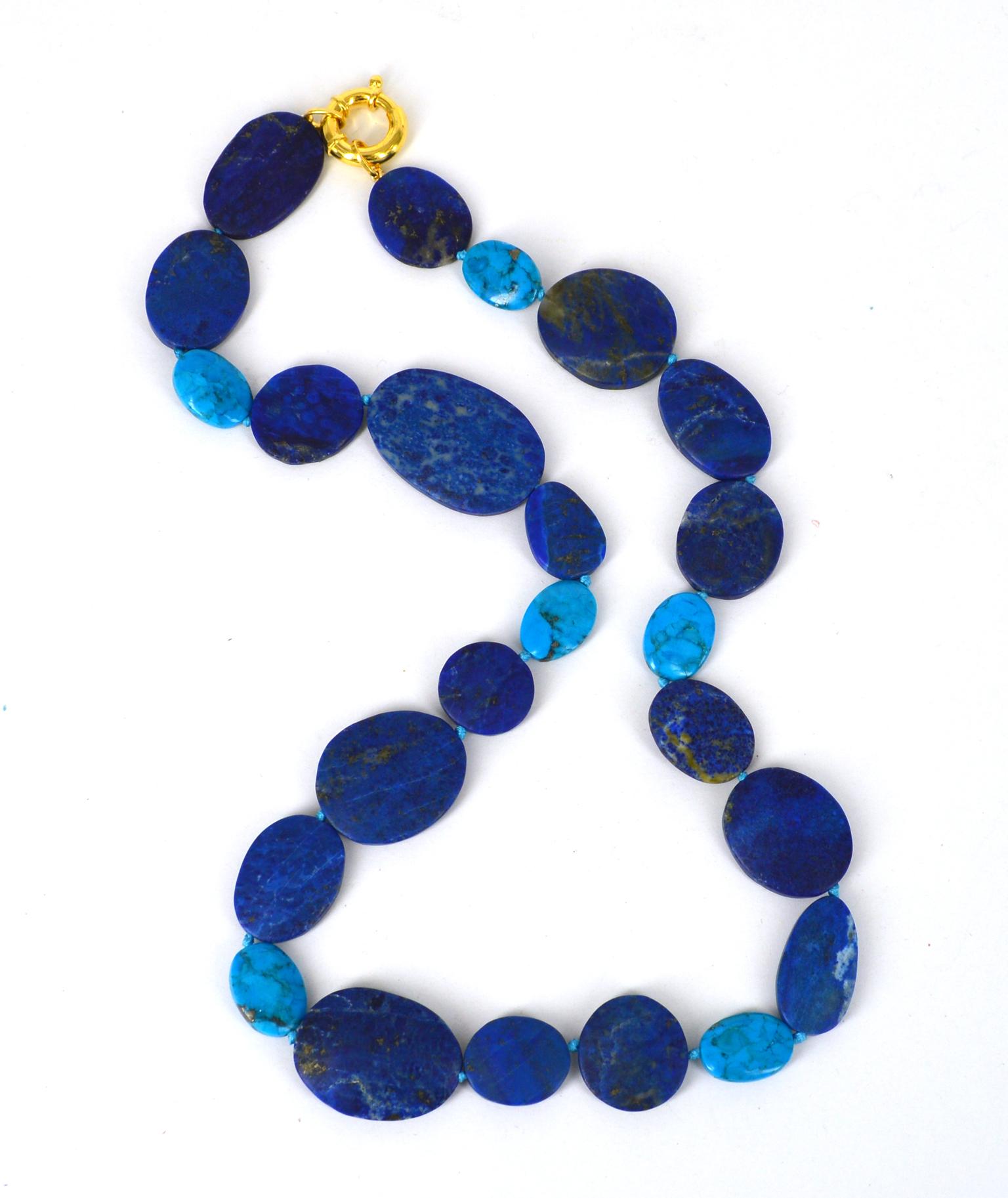 19mm-37mm long matt polished flat oval Lapis Lazuli beads with 18x13mm Arizona Turquoise hand knotted on aqua blue thread with Gold Plate Sterling Silver Bolt clasp 18cm
Total length of necklace 63cm.

