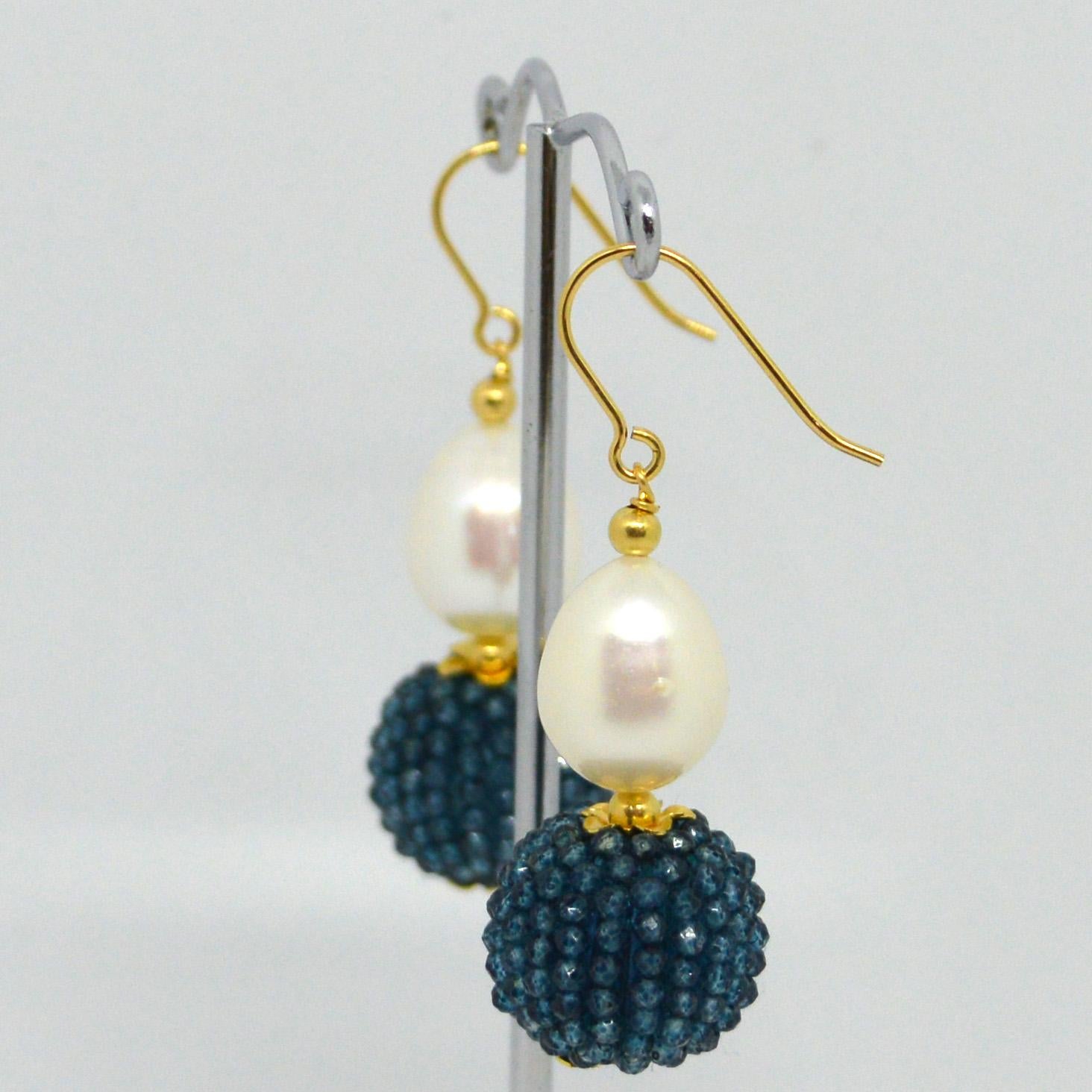 Natural Freshwater Pearl 15x10mm with a hand made beaded bead of natural London Blue Topaz mirco faceted beads 14k Gold Filled headpin and 3mm beads and Sheppard.

Total Earring length 45mm.
