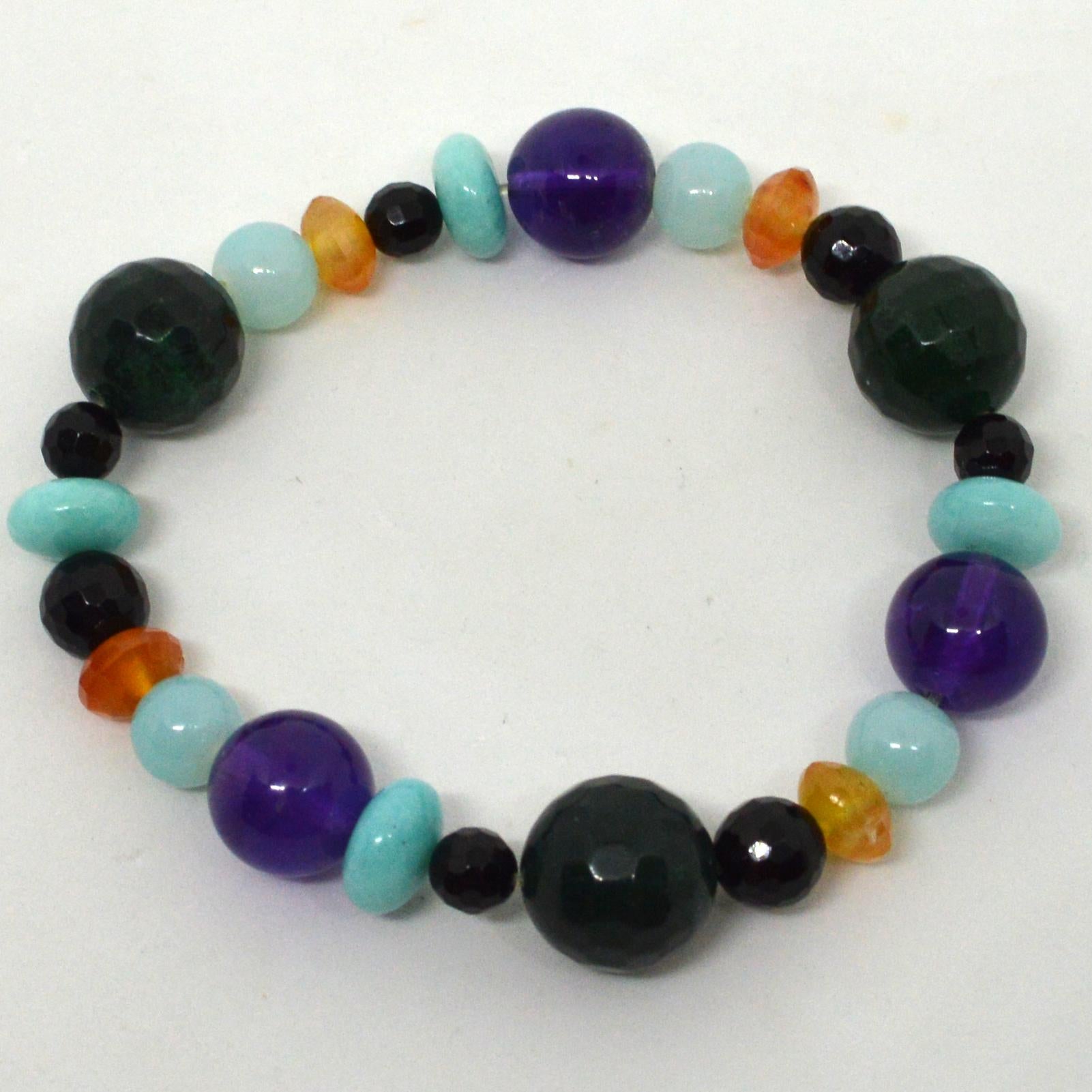 Barcelona elastic bracelet made from 6mm, 8mm, 14mm faceted Onyx, 12mm polished Amethyst, 8x5mm Faceted Carnelian, 10x5mm polished Amazonite and 8mm aqua glass beads.
Fits  up to 18cm wrist.
Custom alterations available