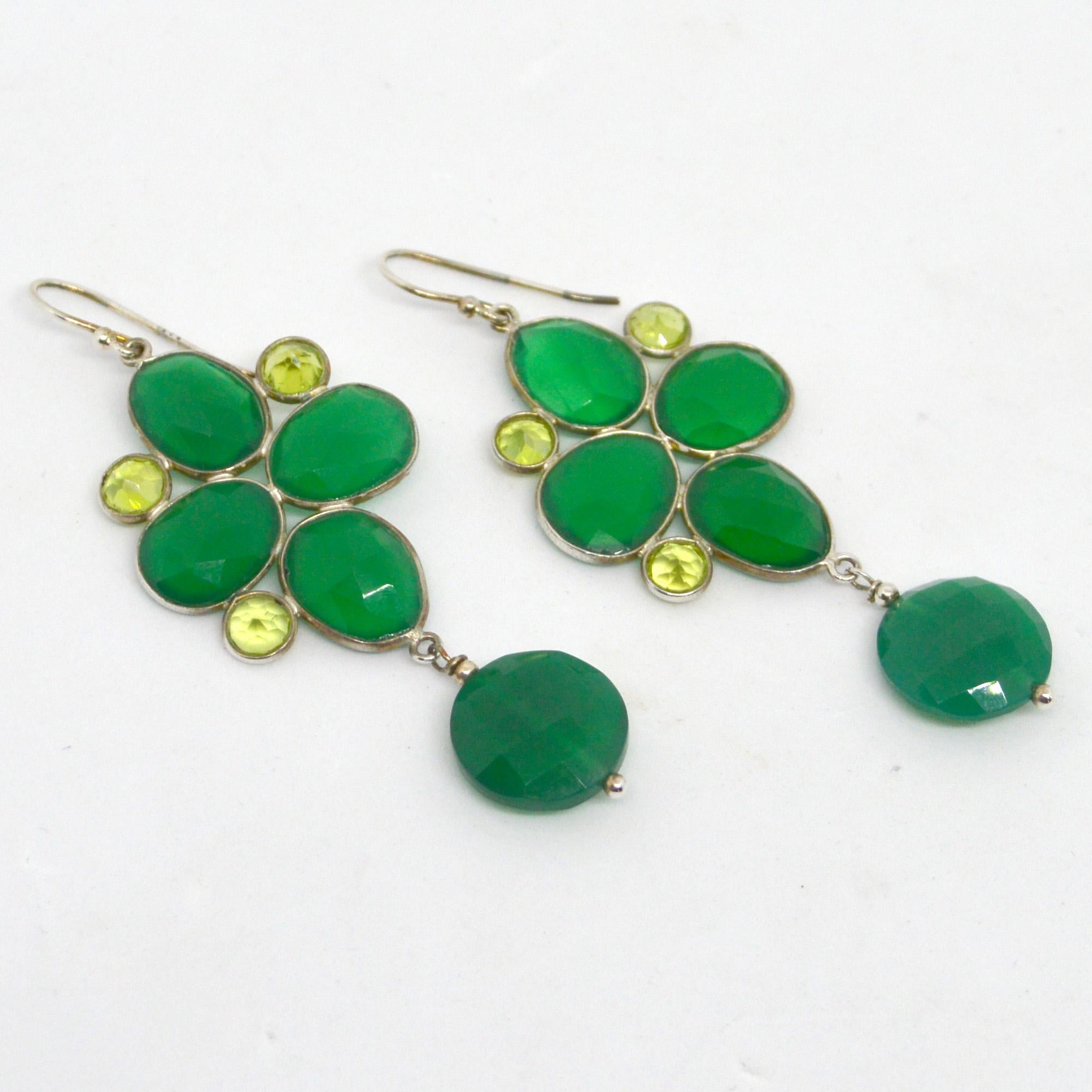  Green with Envy luscious Peridot and Green Onyx set in Sterling Silver, Peridot 5mm Round Brilliant cut with Oval Green Onyx 10x12mm and a 14mm Faceted flat round drop. 
Metal Sterling Silver

Total Earring length 70mm.
